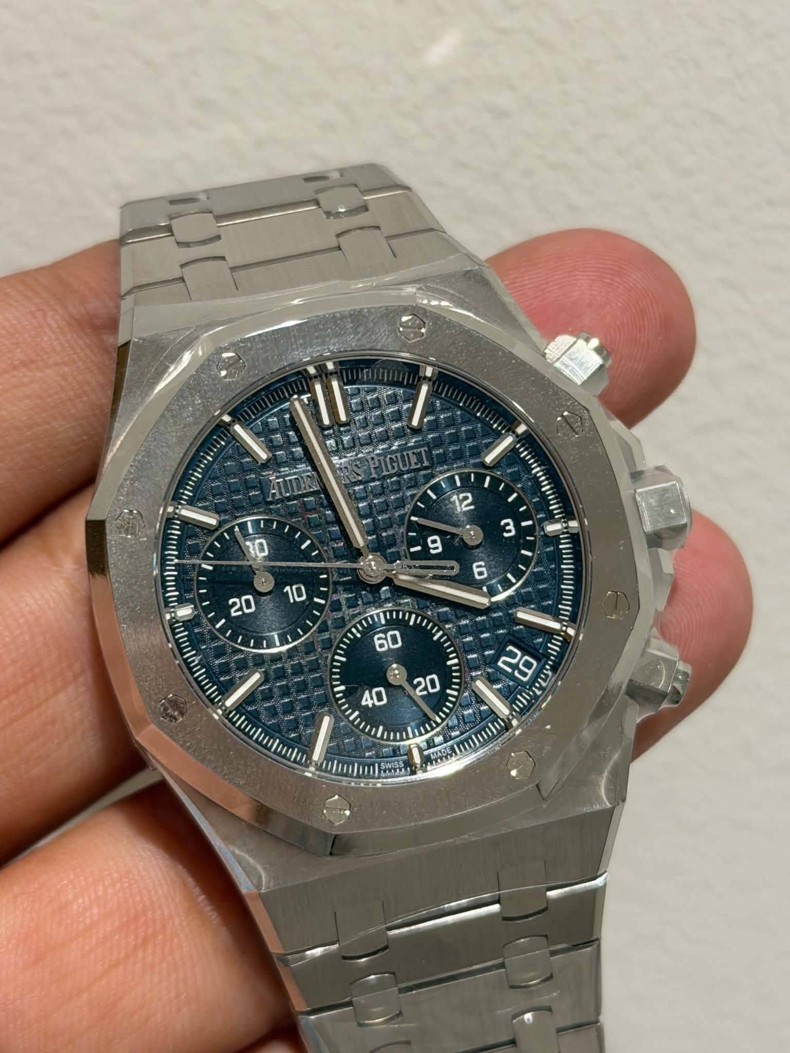 May be an image of wrist watch and text