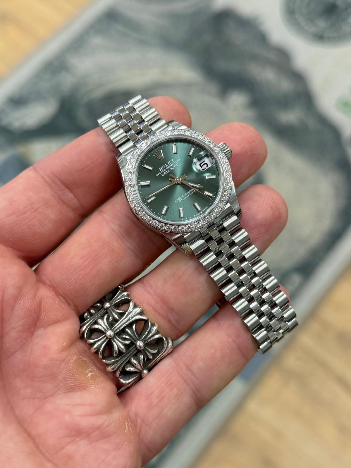 May be an image of wrist watch and text