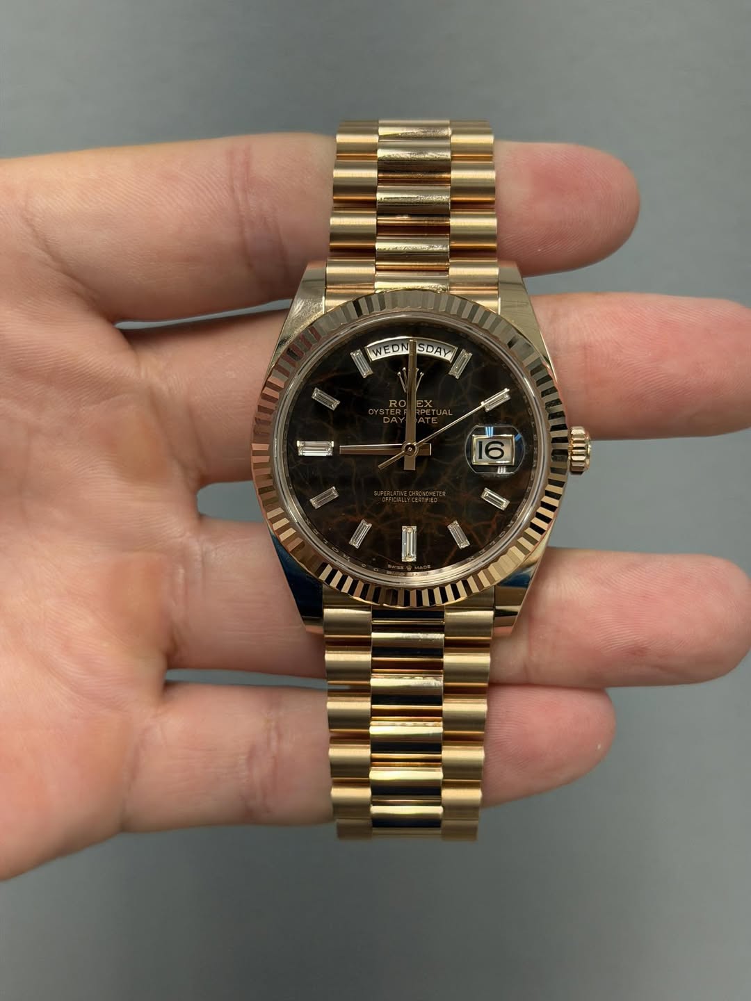 May be an image of wrist watch and text