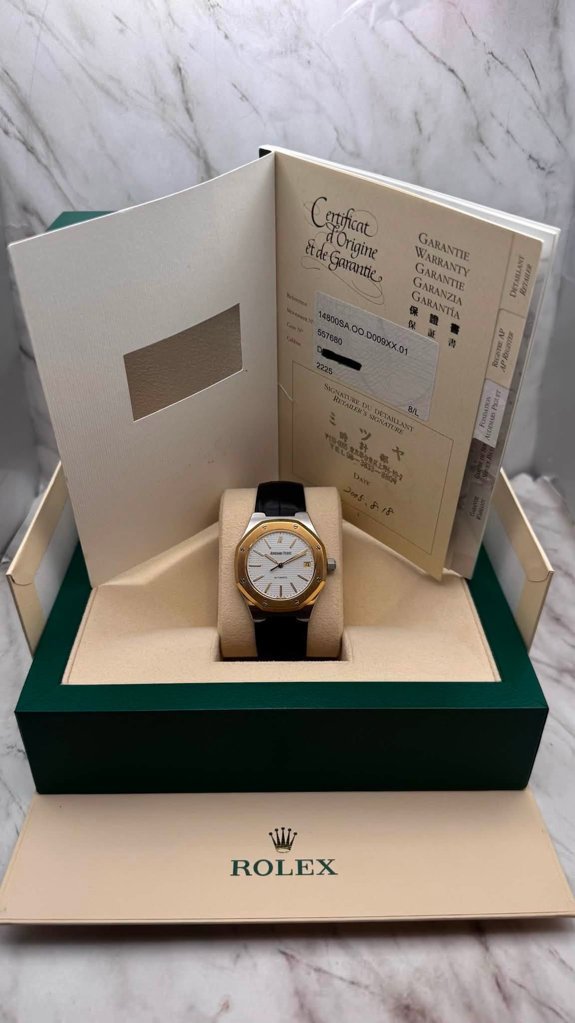 May be an image of wrist watch and text