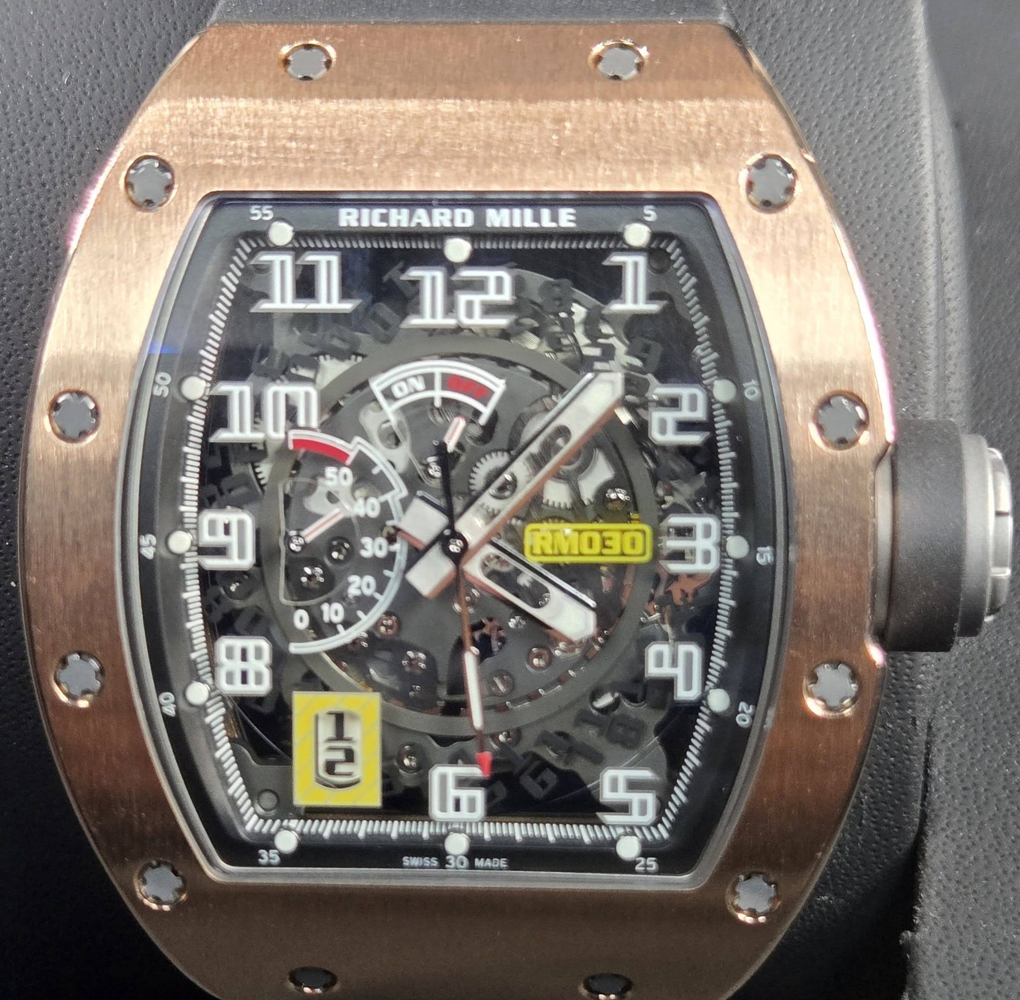 May be an image of wrist watch and text
