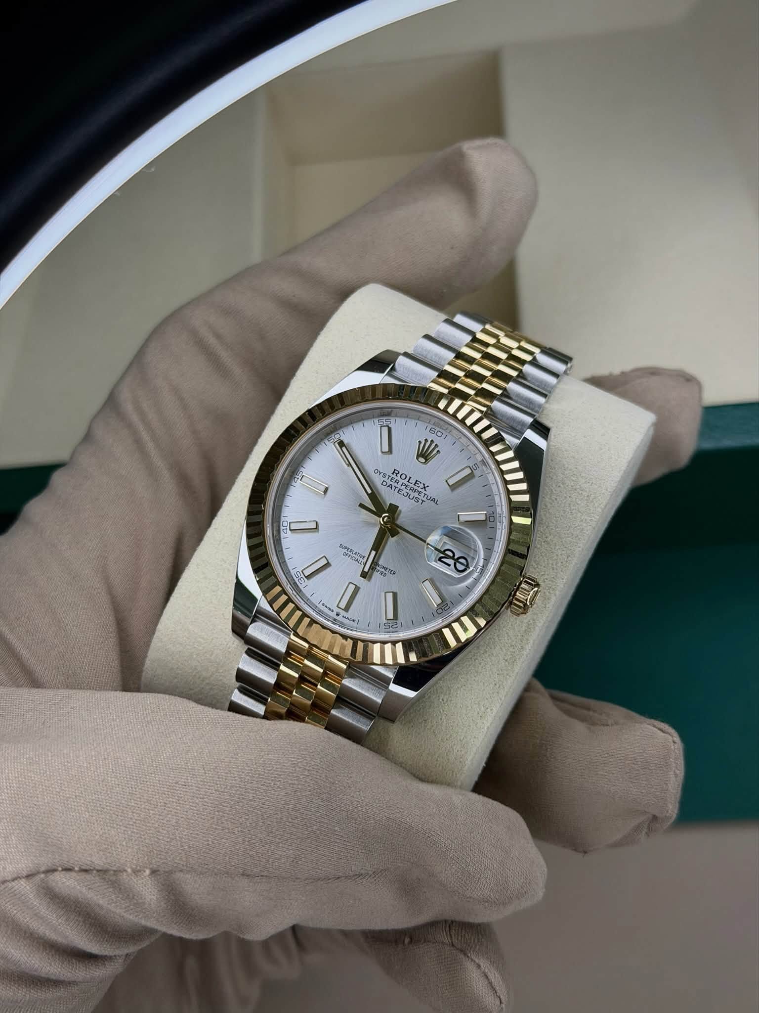 May be an image of wrist watch and text