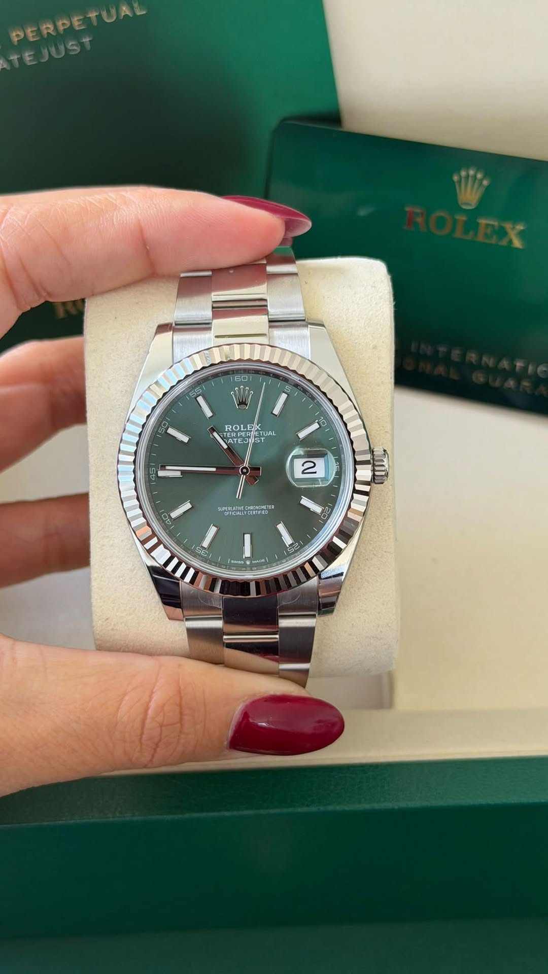 May be an image of wrist watch and text