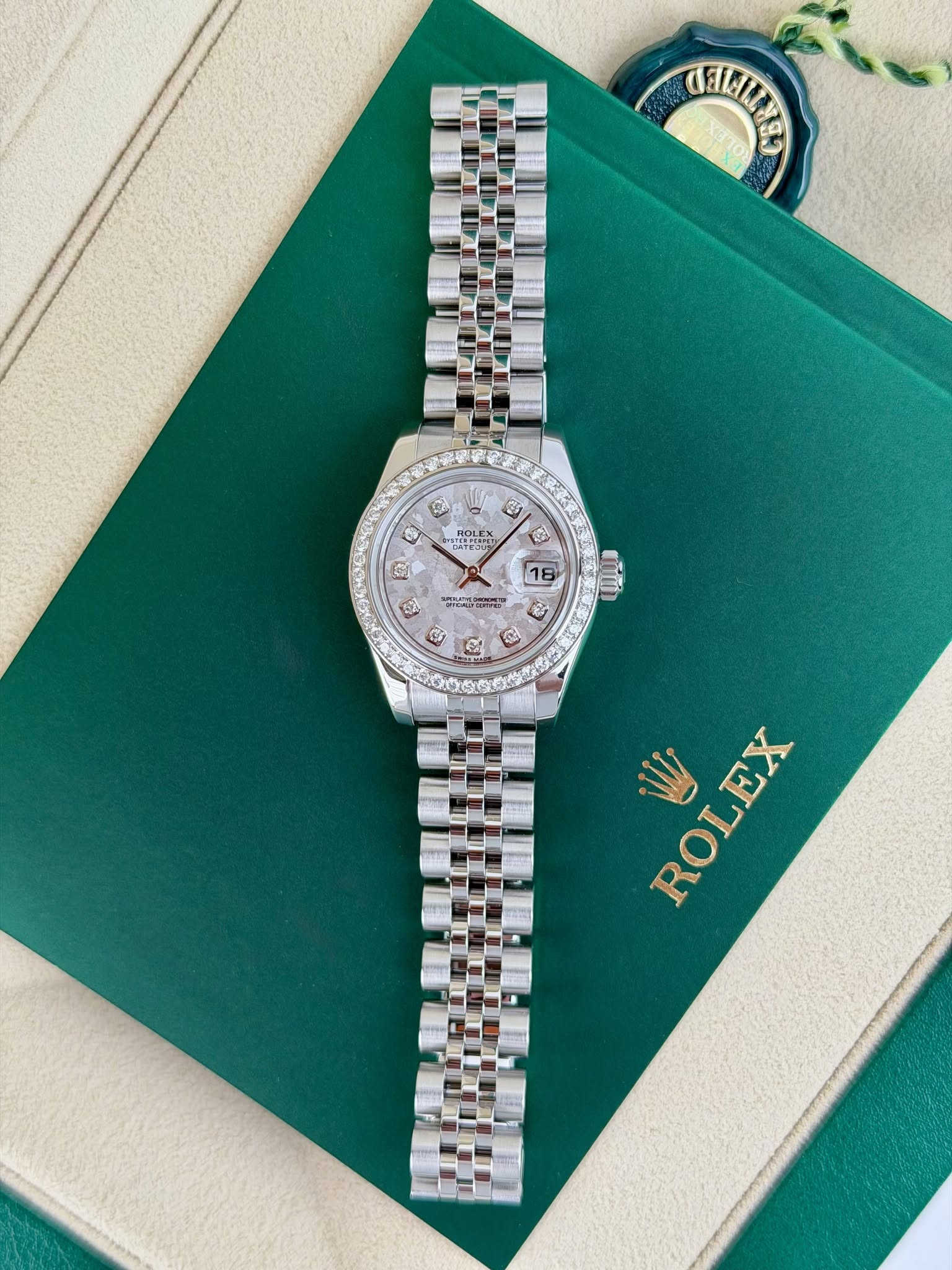 May be an image of wrist watch and text