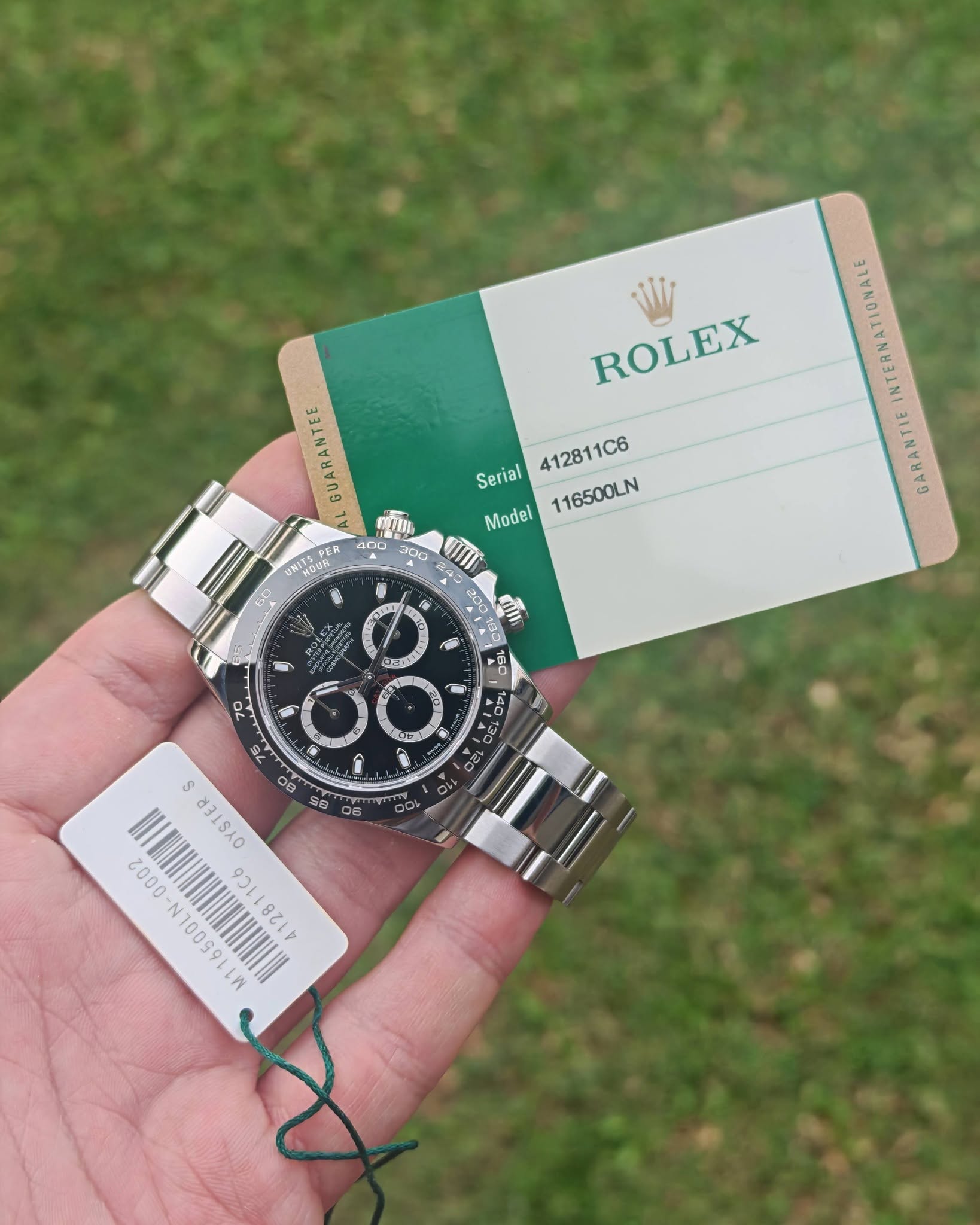 May be an image of wrist watch and text that says 'ROLEX GUARANTEE 412811C6 Serial Model 116500LN HITEPER UNITEPE INTERNATIONALE GARANTIE 讀 ま雅 0 DA SD 6 70 40 ធរើ 00 12 س 口B J…