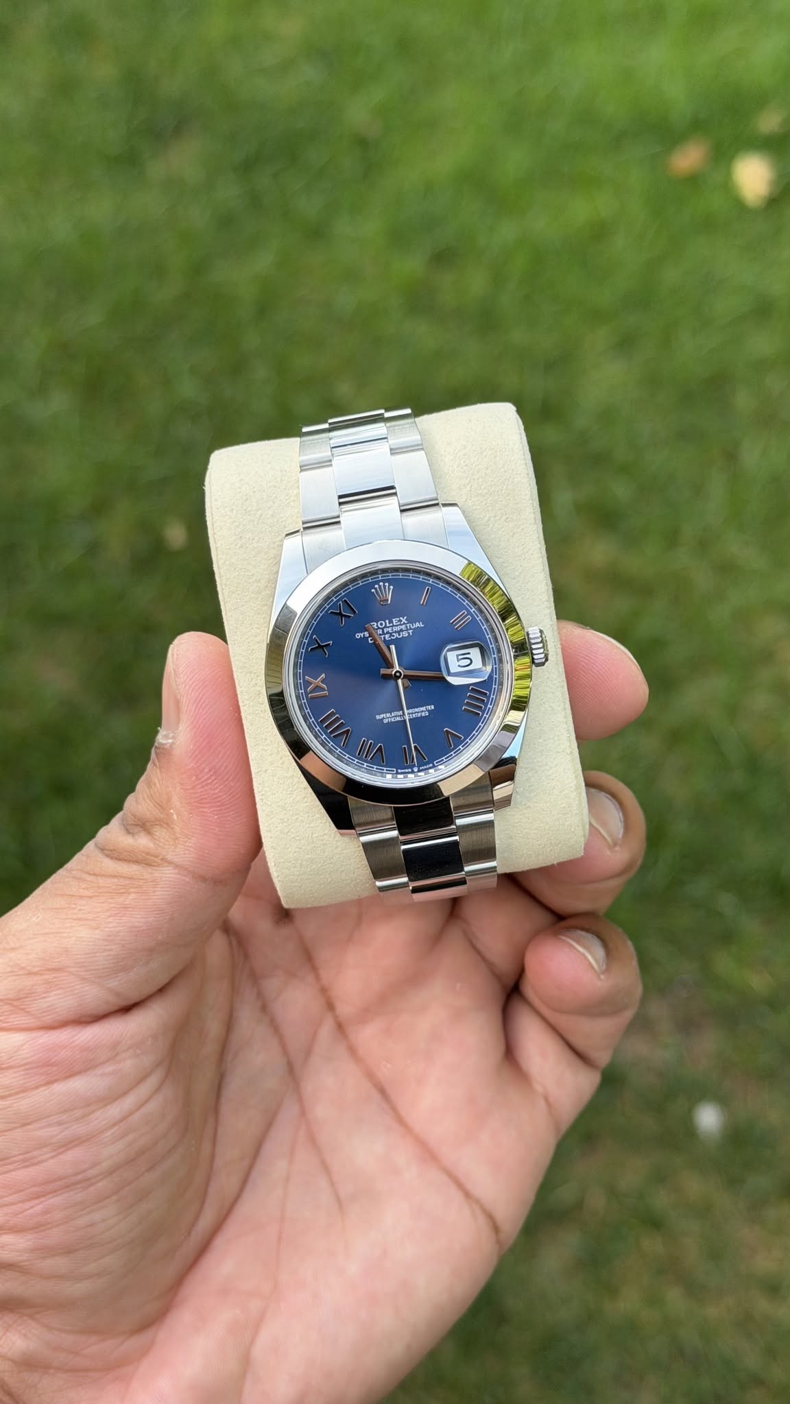 May be an image of wrist watch and text