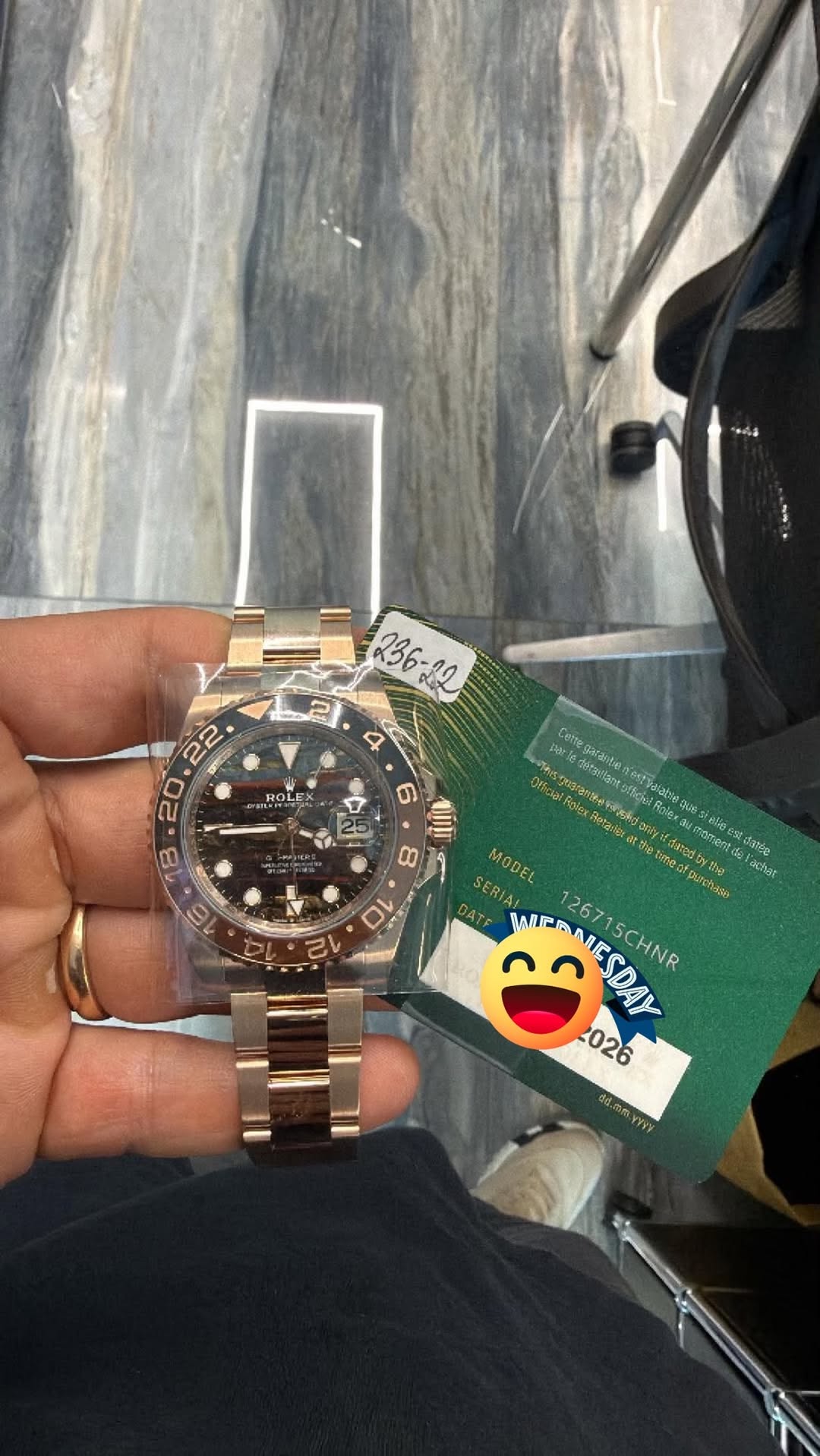 May be an image of money, wrist watch and text