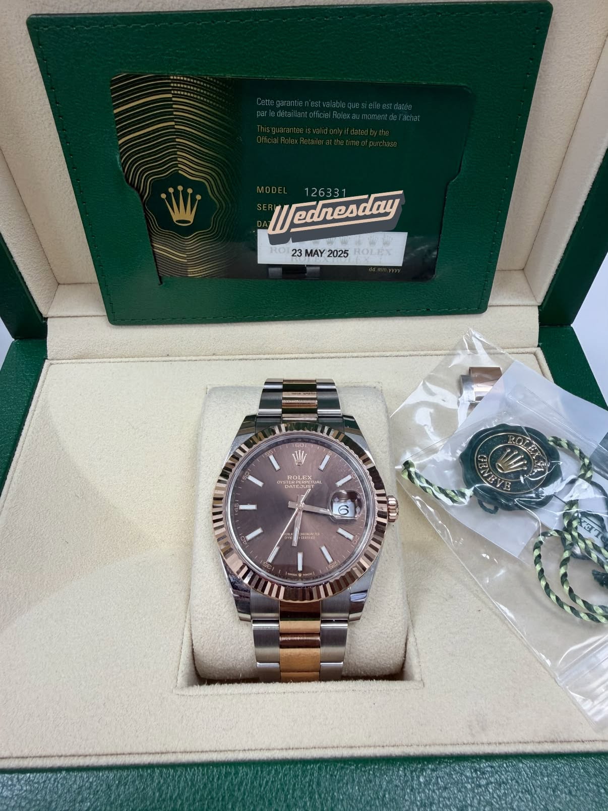 May be an image of wrist watch and text