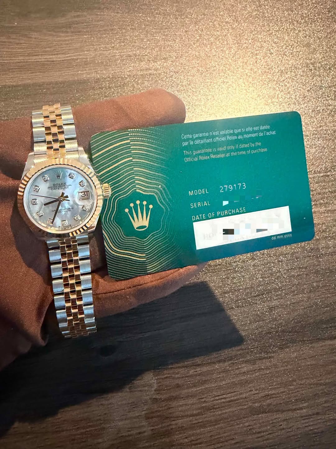May be an image of money, wrist watch, ticket stub and text