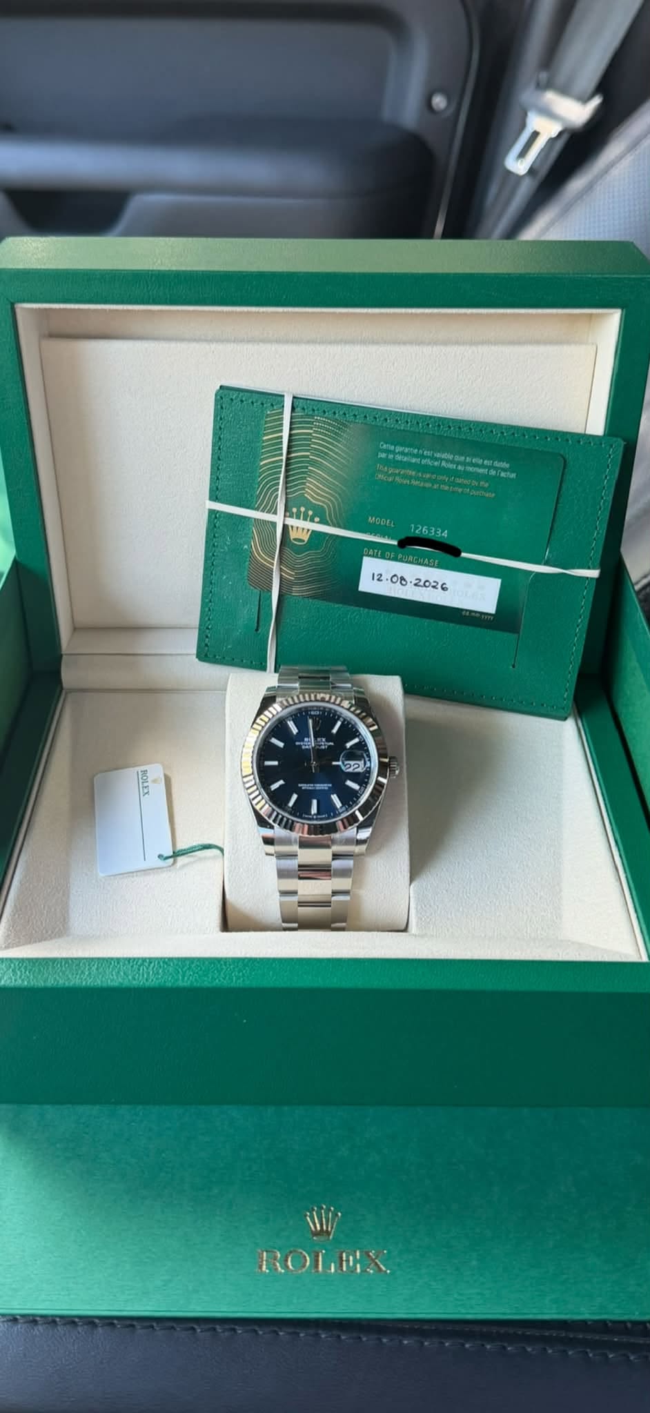 May be an image of wrist watch and text