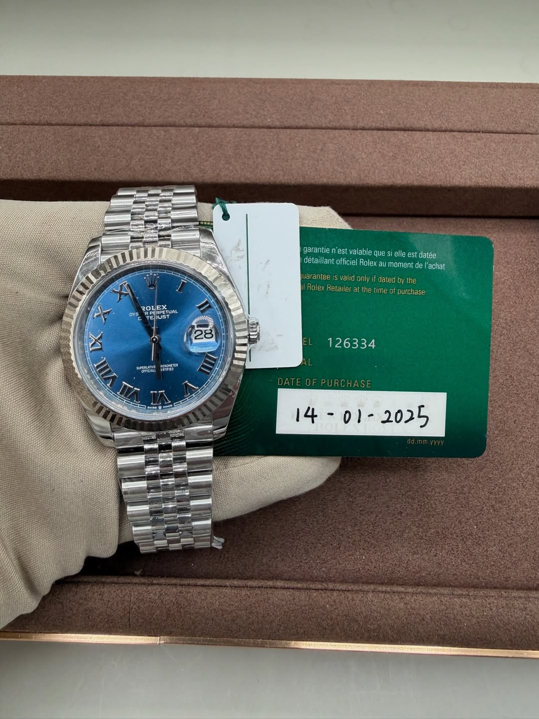 May be an image of wrist watch and text