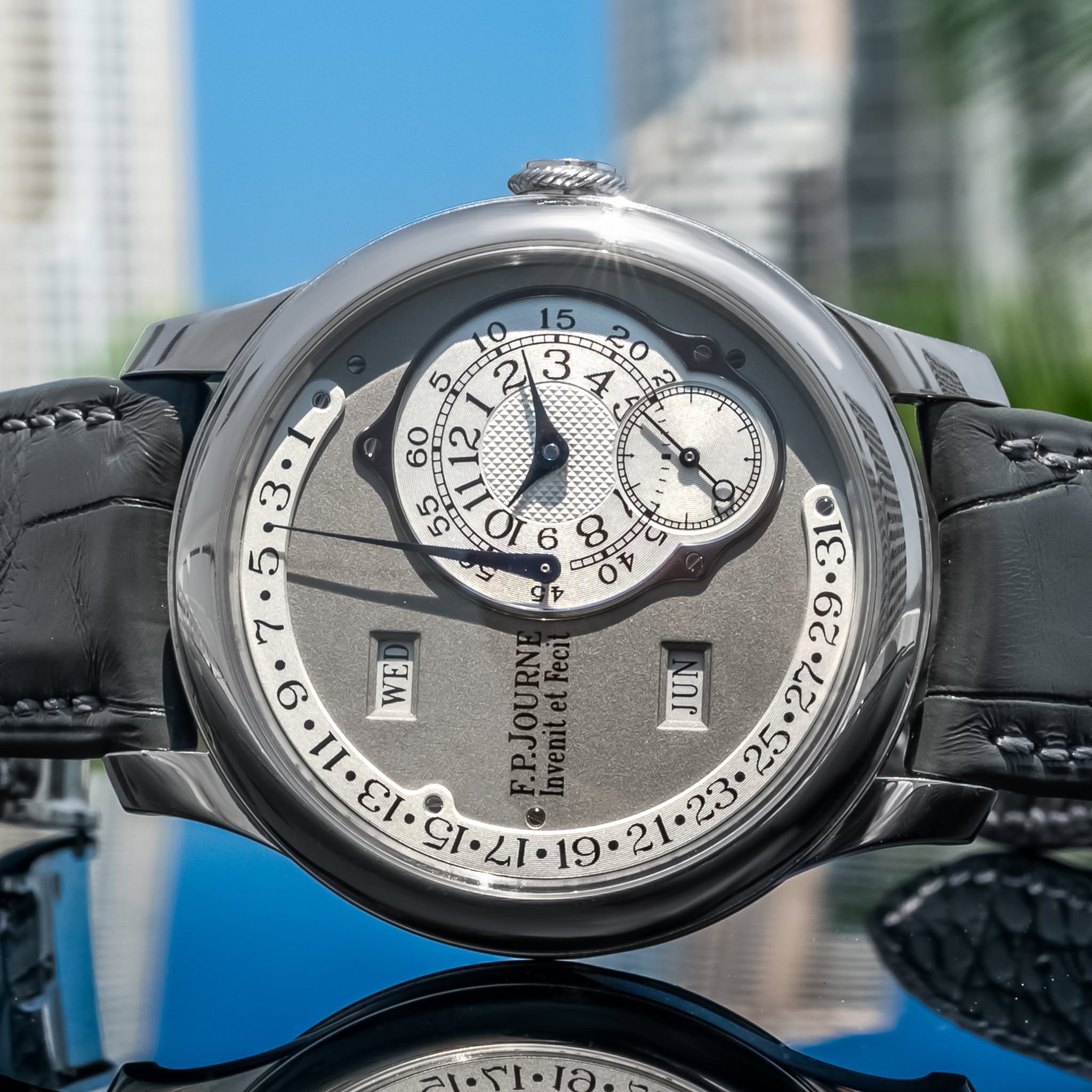 May be an image of wrist watch and text