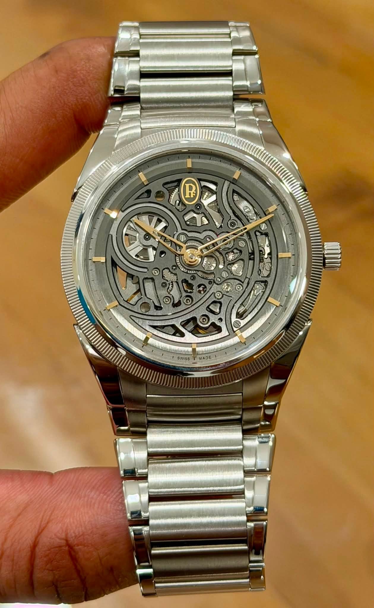 May be an image of wrist watch and text