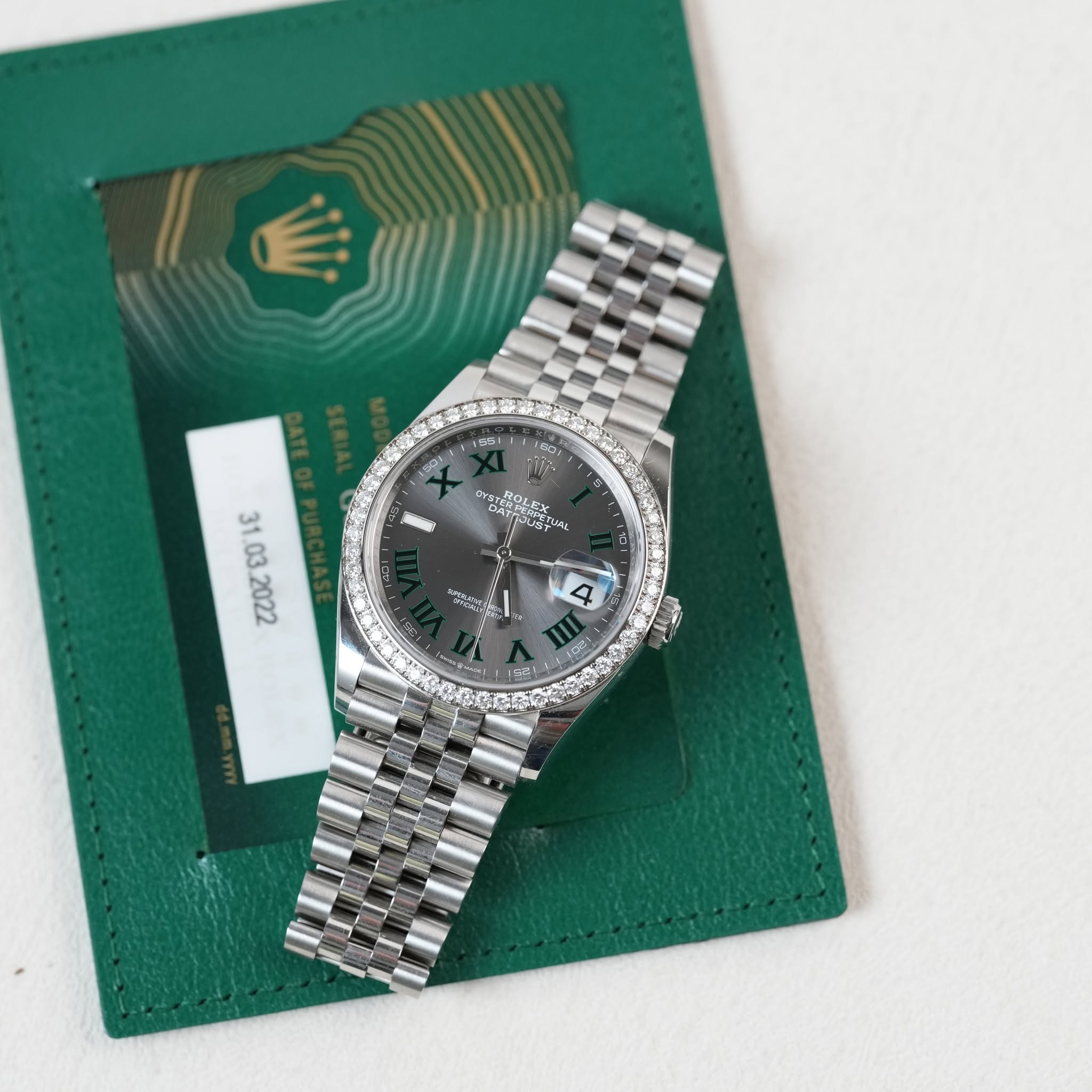 May be an image of wrist watch and text