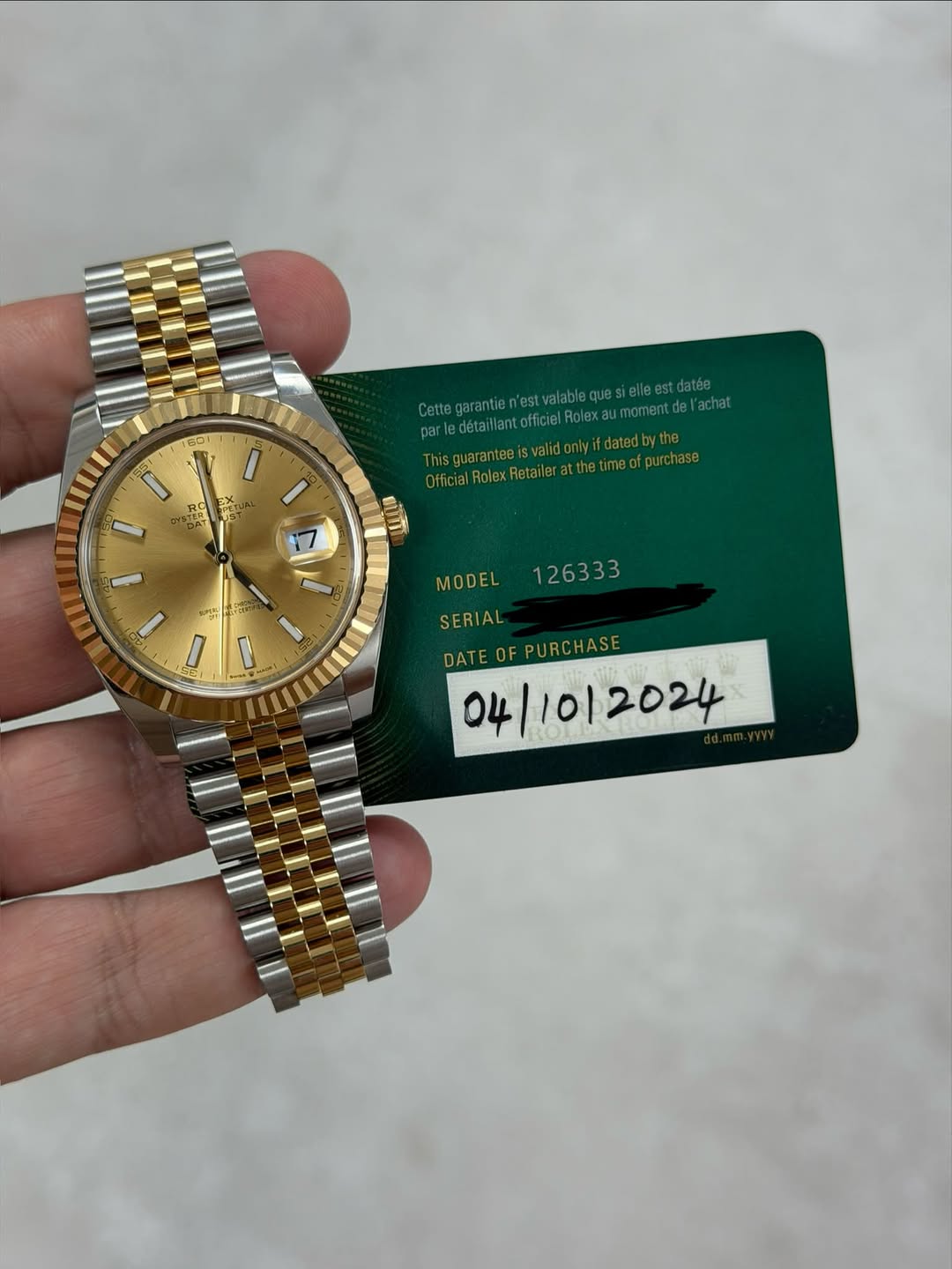 May be an image of wrist watch and text