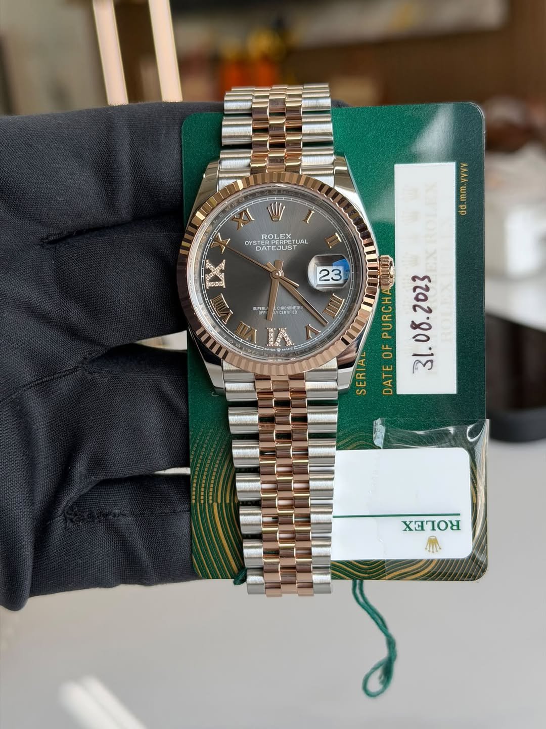 May be an image of wrist watch and text