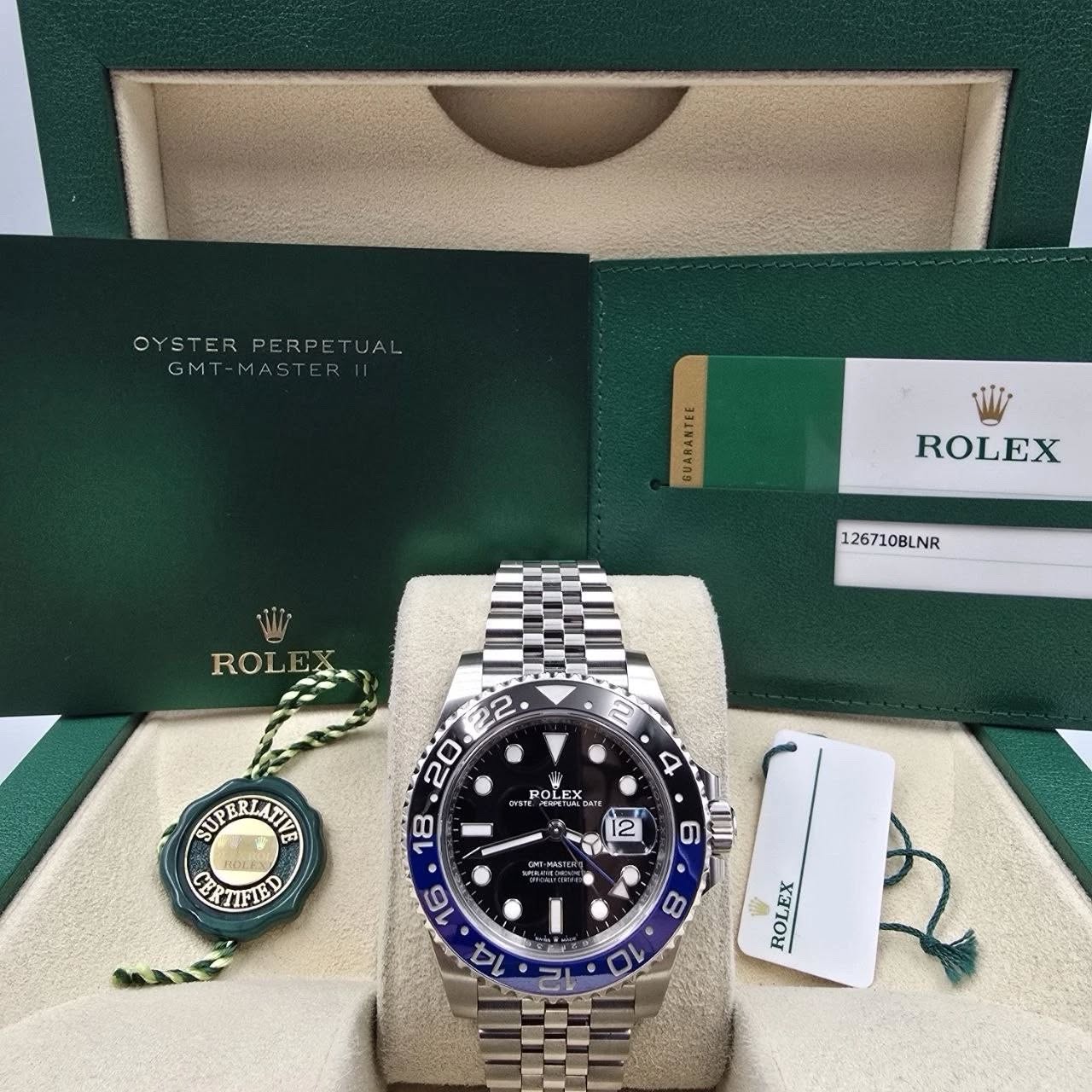 May be an image of wrist watch and text that says 'OYSTERPERPETUAL OYSTER PERPETUA UAL GMT-MASTERII GM7 GMT-MAST ANTEE BUARANTEE ROLEX 126710BLNR ROLEX ROL 2 4 OLEX وشدت EYSTE…