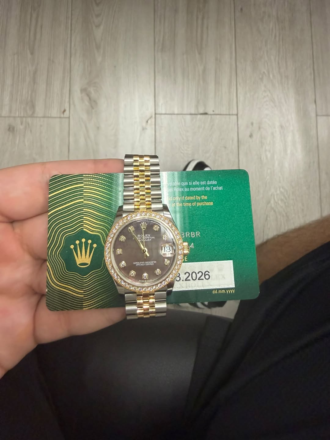 May be an image of wrist watch and text