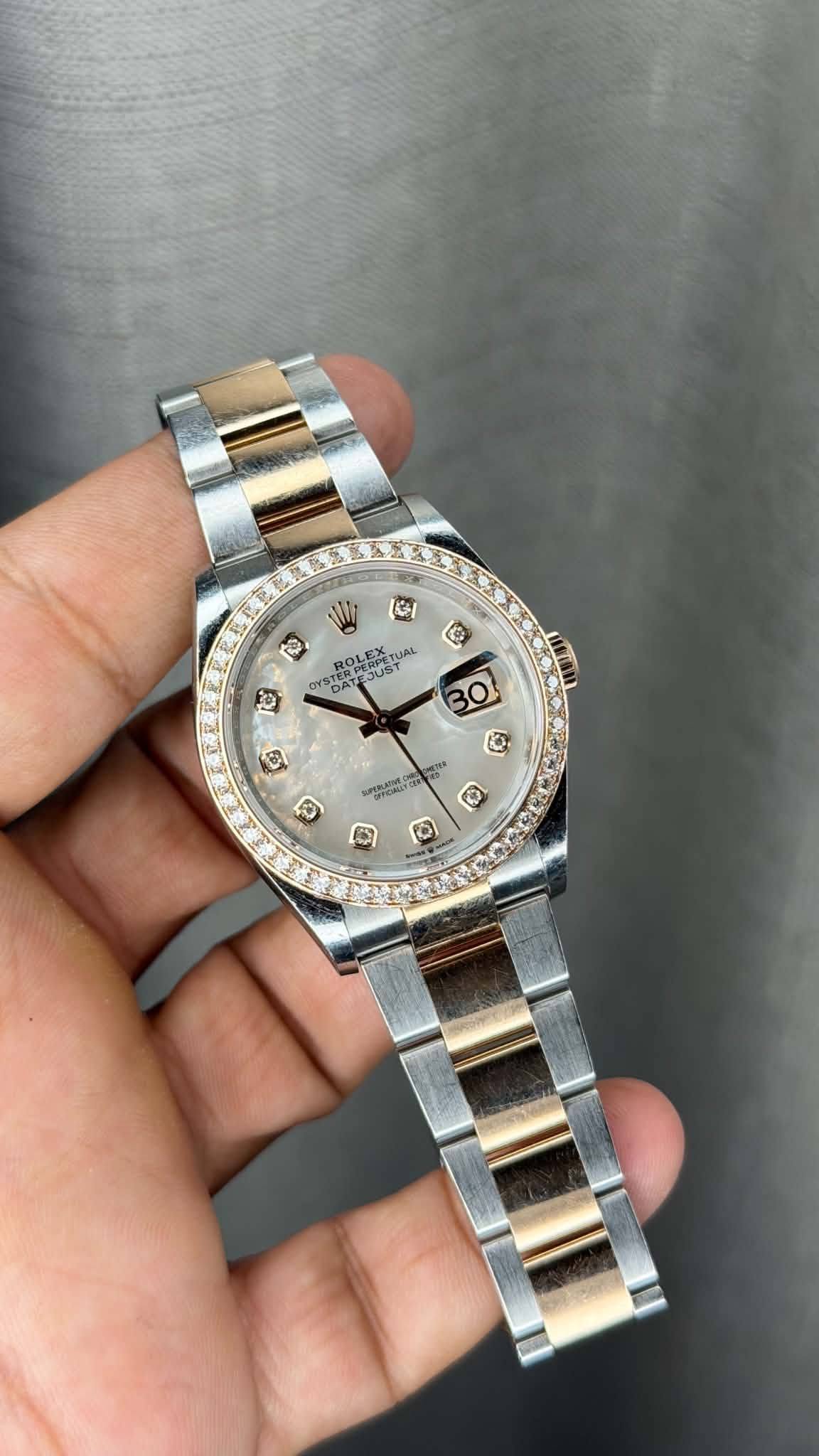 May be an image of wrist watch and text