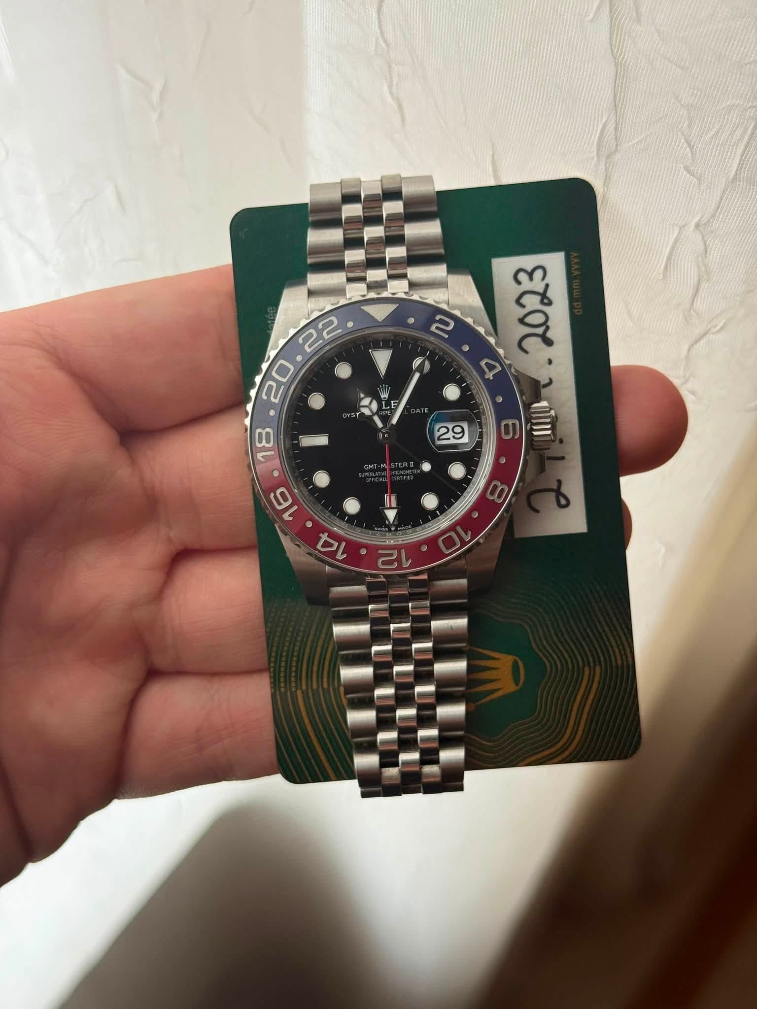 May be an image of wrist watch and text