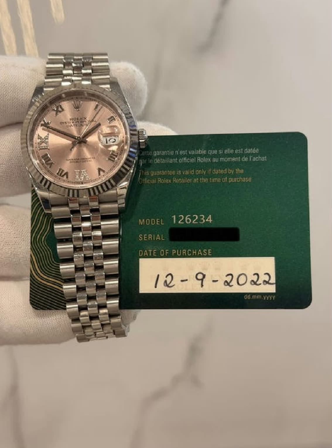 May be an image of wrist watch and text