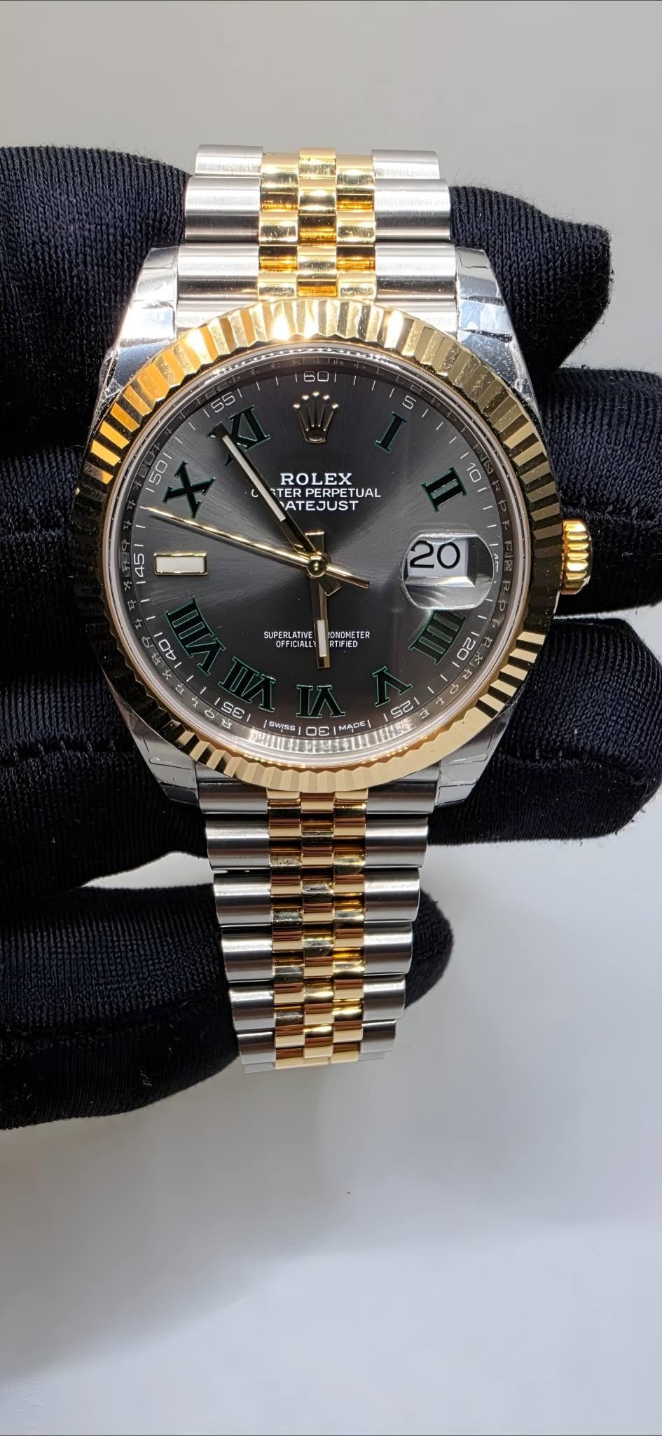 May be an image of wrist watch and text