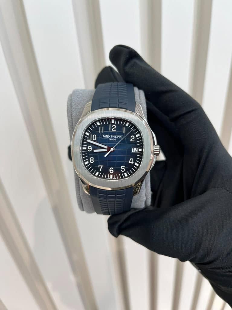 May be an image of wrist watch and text that says '12 PATEK KPHI UPPE ATEN ENEVE M II '