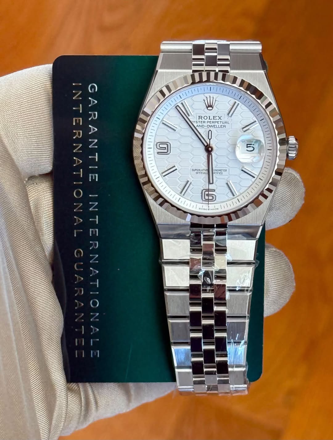 May be an image of wrist watch and text