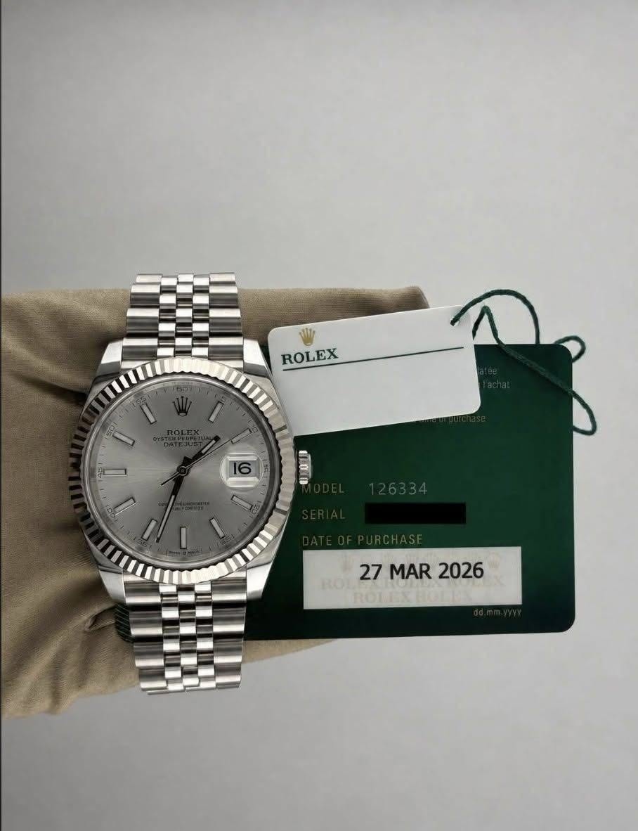 May be an image of wrist watch and text that says 'ROLEX a N ROI noL 27MAR2026 27 MAR 2026'