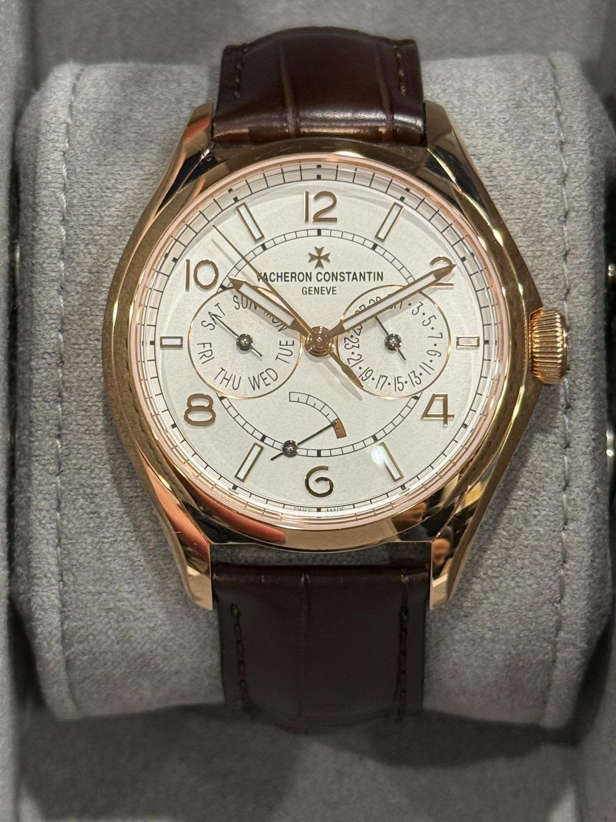 May be an image of wrist watch and text