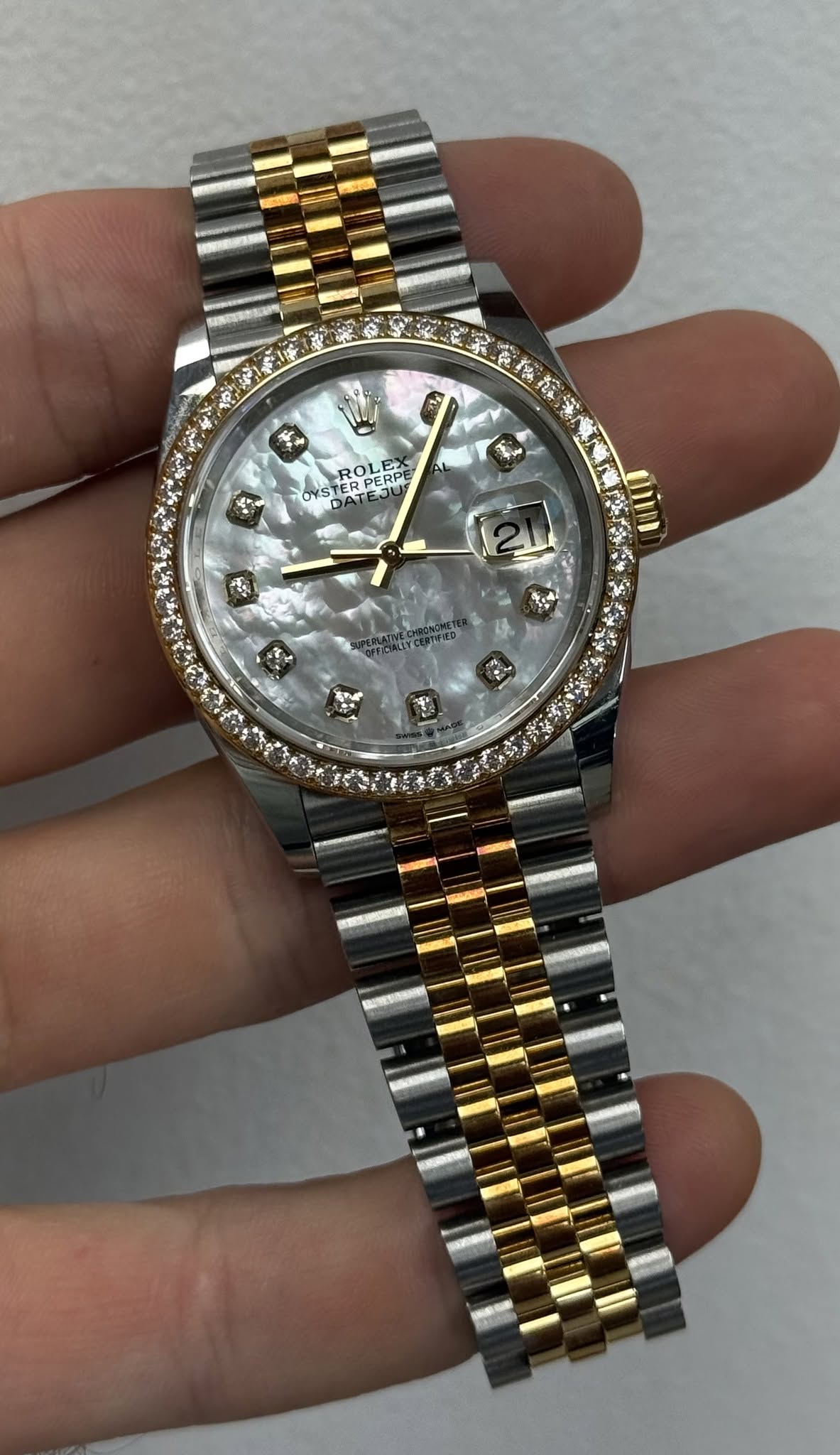 May be an image of wrist watch and text