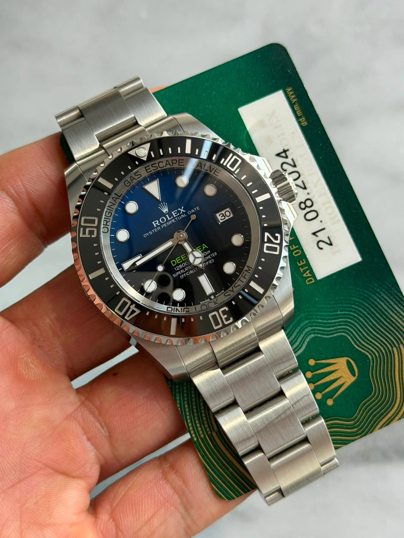 May be an image of wrist watch and text that says '50 ORIG ROLEX 30 10 20 L207 DE DINI 40 30 AA AAA'