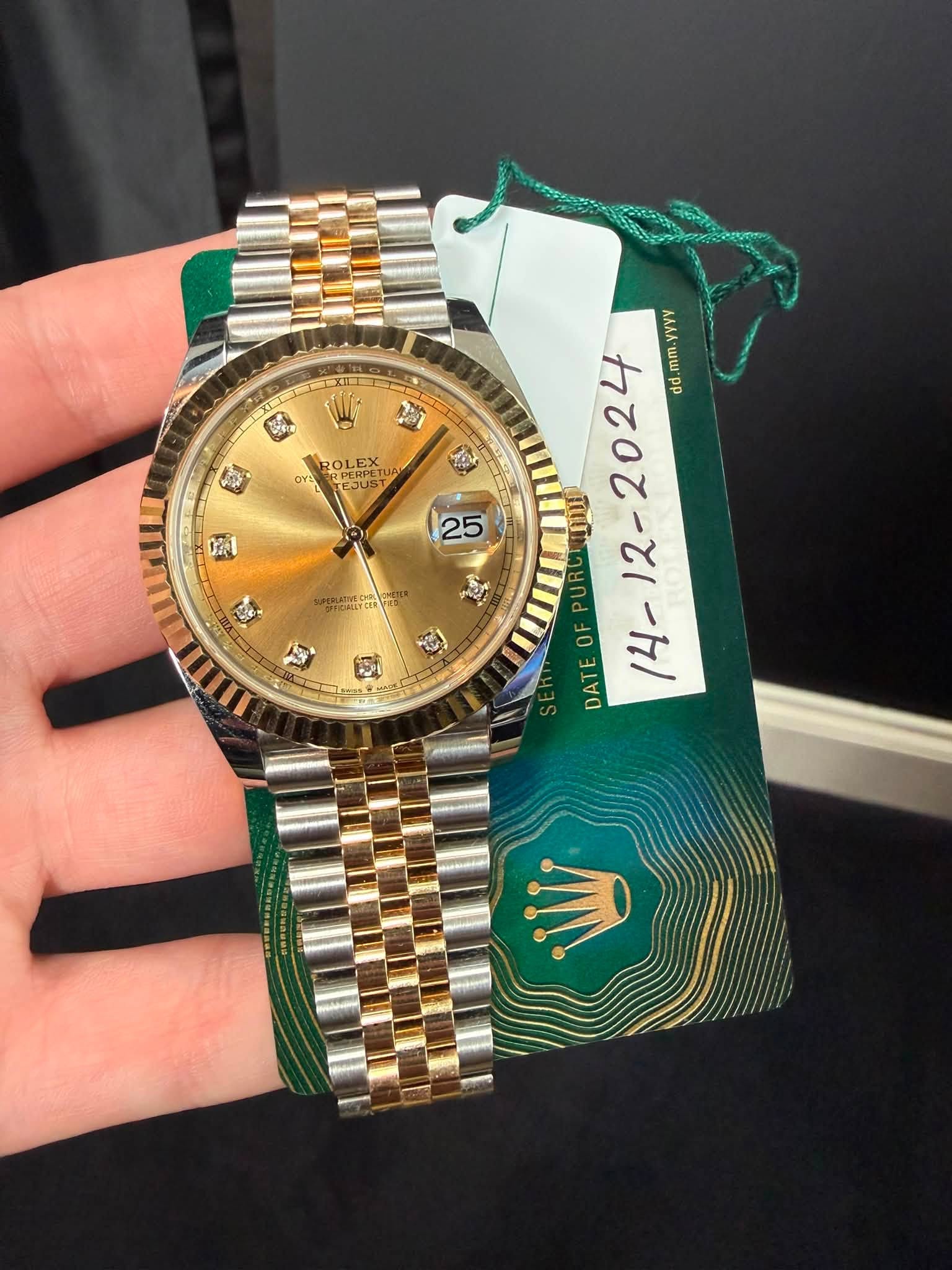 May be an image of wrist watch and text