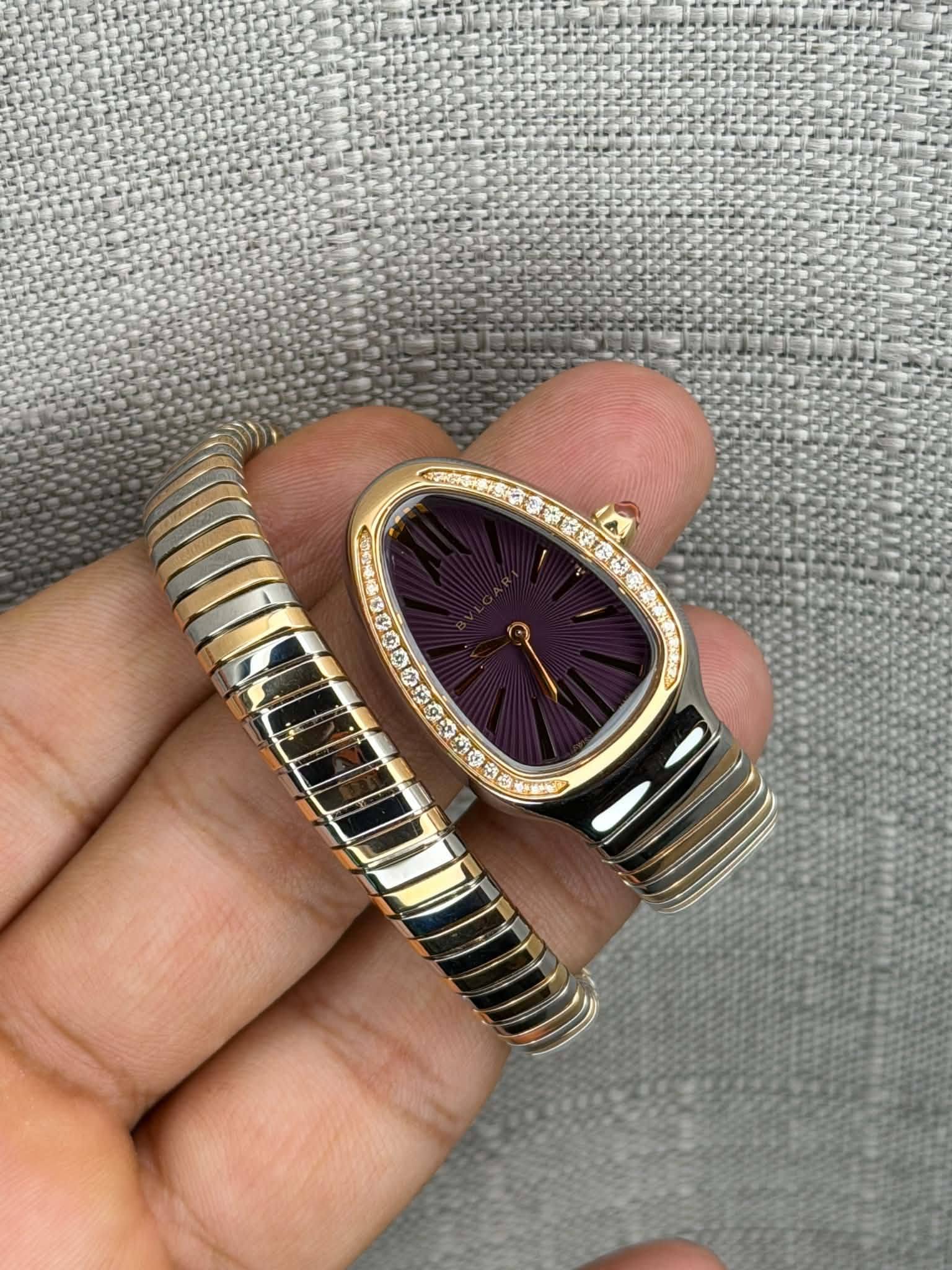 May be an image of wrist watch, jewelry and text
