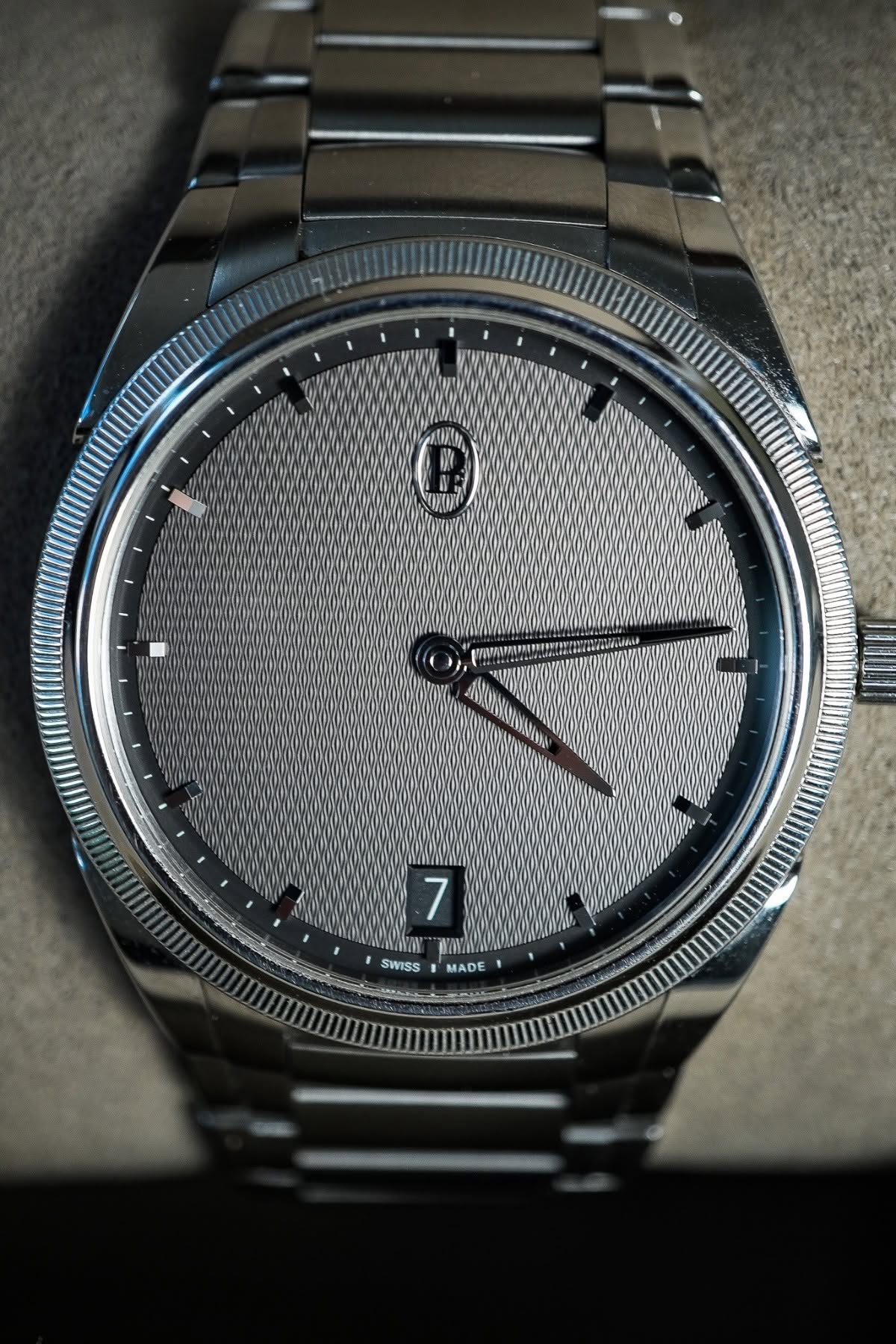 May be an image of wrist watch and text that says 'e 7 WYW MADE SWISS'