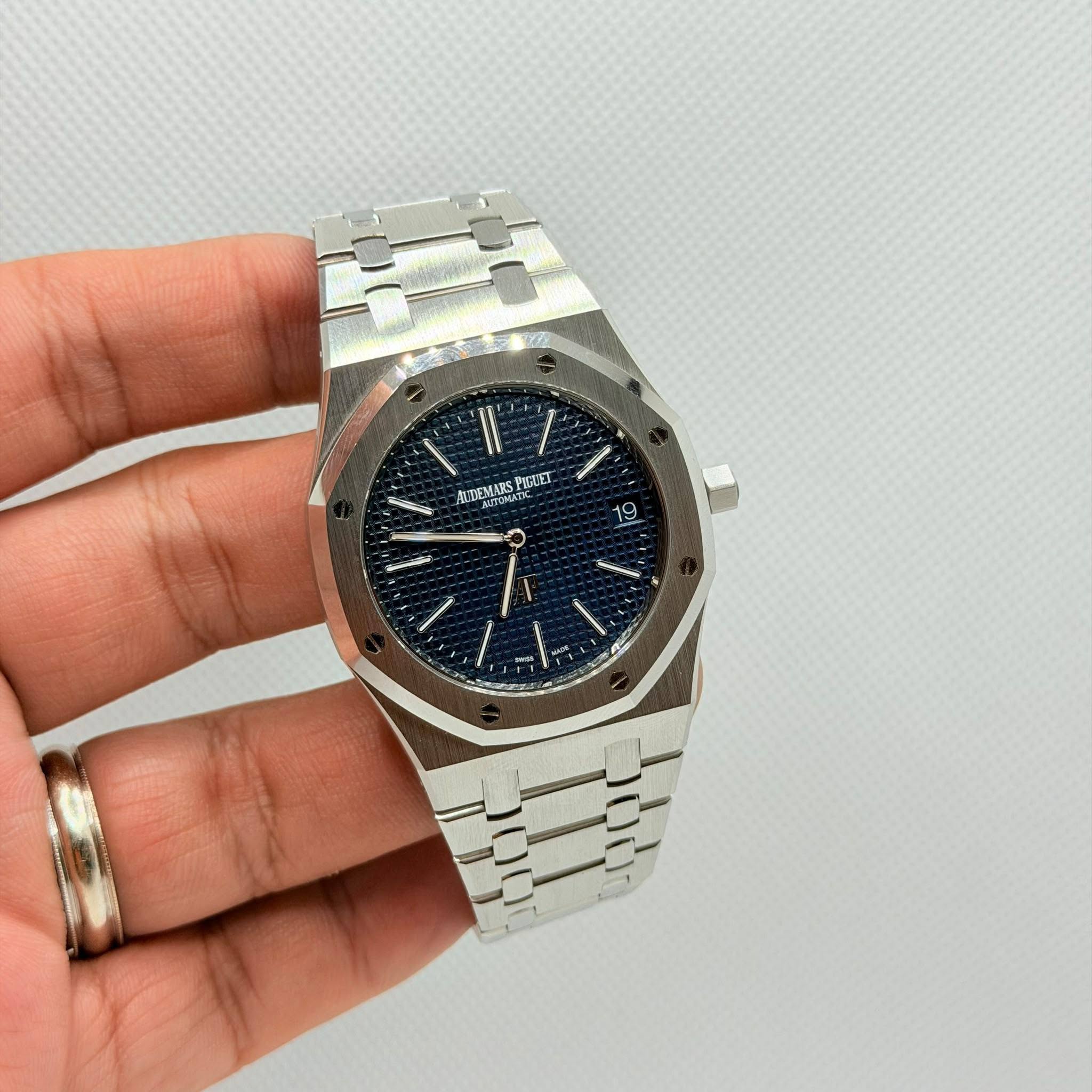 May be an image of wrist watch and text