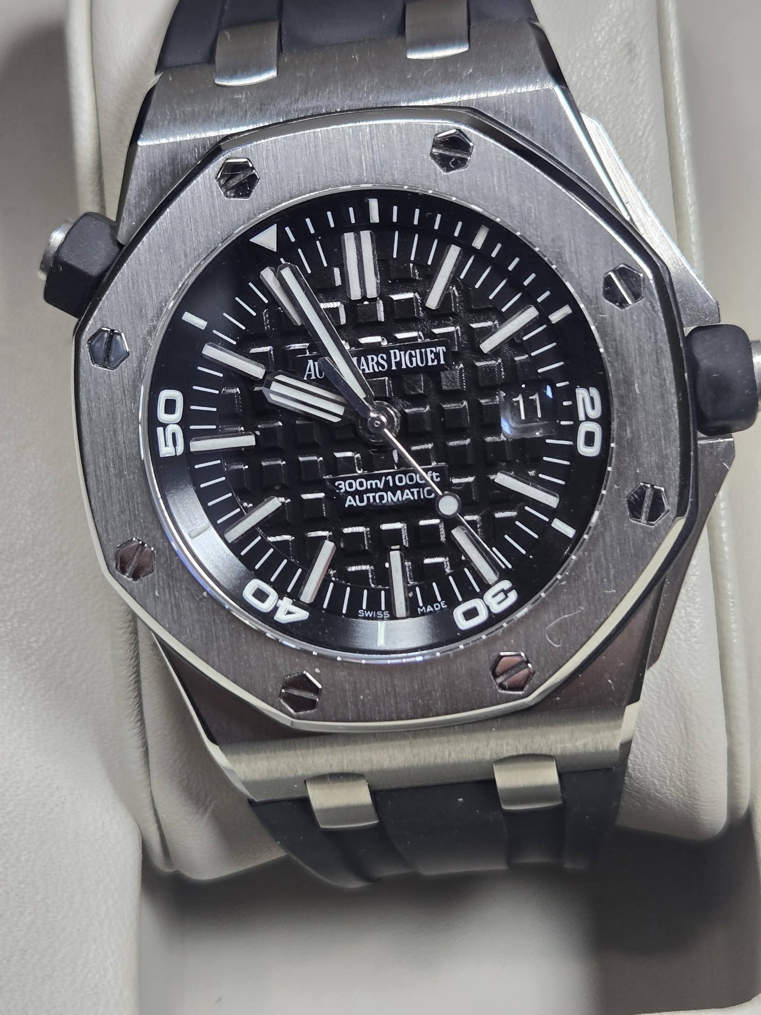 May be an image of wrist watch and text that says 'POa AU ARS SPIGUET 0 50 300m 300m/100L 003 OOLY AUTOMATIC 20 SWISS 0F MADE mS 4'