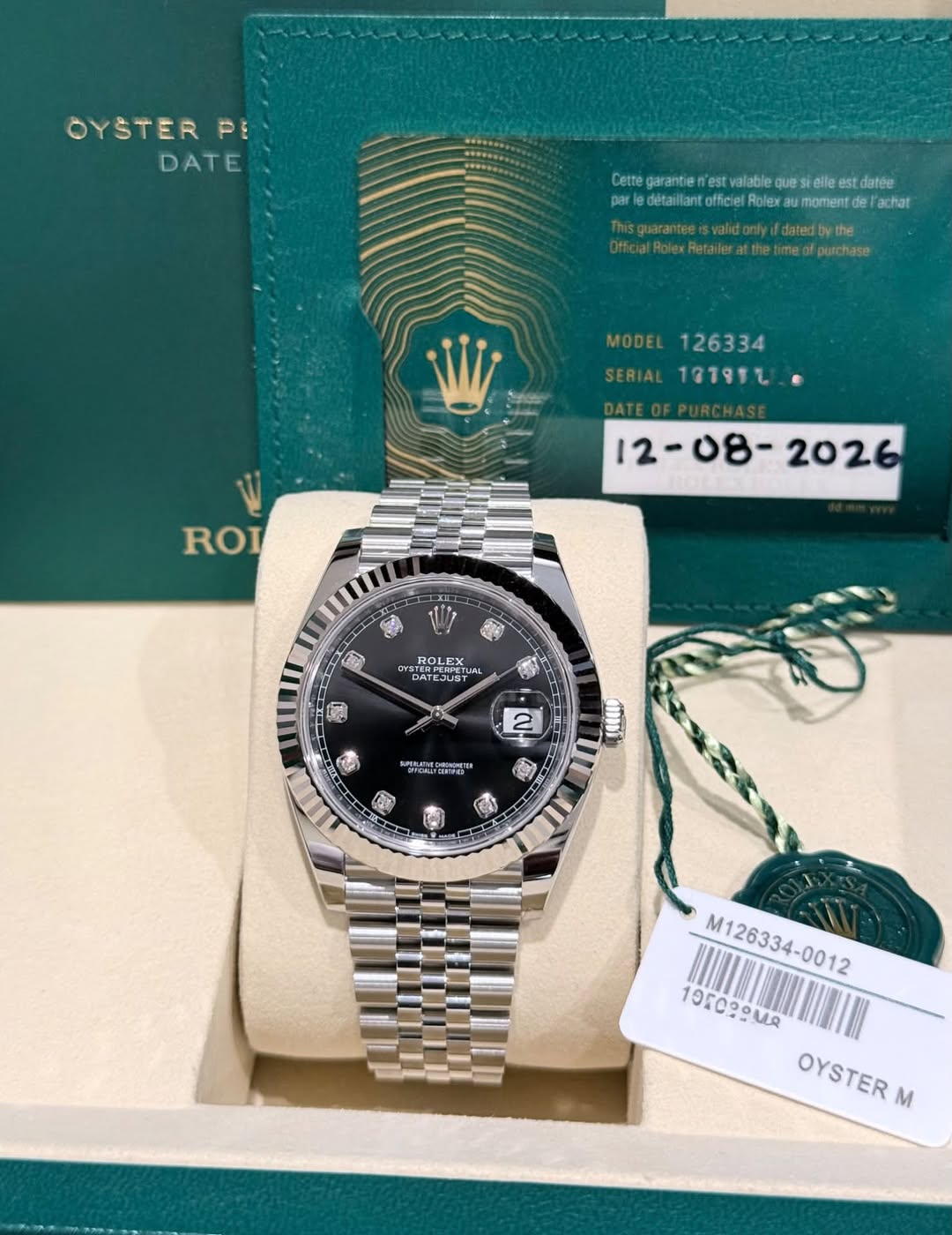 May be an image of wrist watch and text