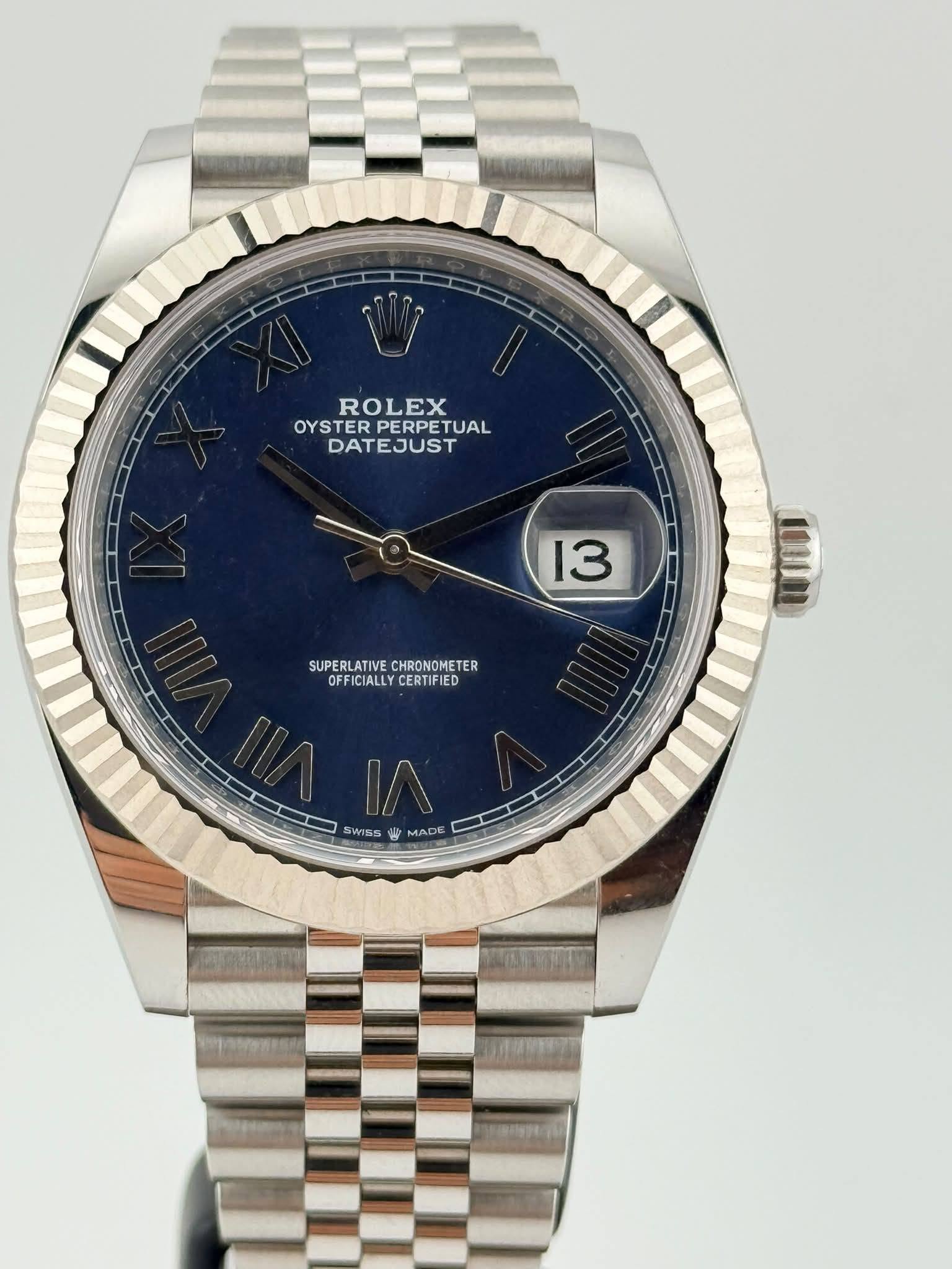 May be an image of wrist watch and text that says 'ROLEX OYSTER TERPERPETUAL PERPET TUAL DATEJUST 13 AN 0 WIIOI SUPERLATIVE SUPERLATIVECHRONOMETER CHRONOMETER ER OFF OFFICIALLY…