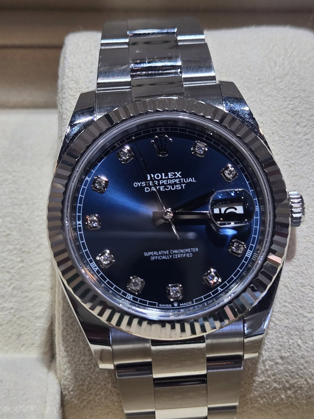 May be an image of wrist watch and text