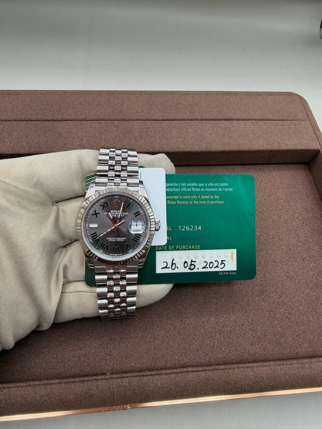 May be an image of wrist watch and text