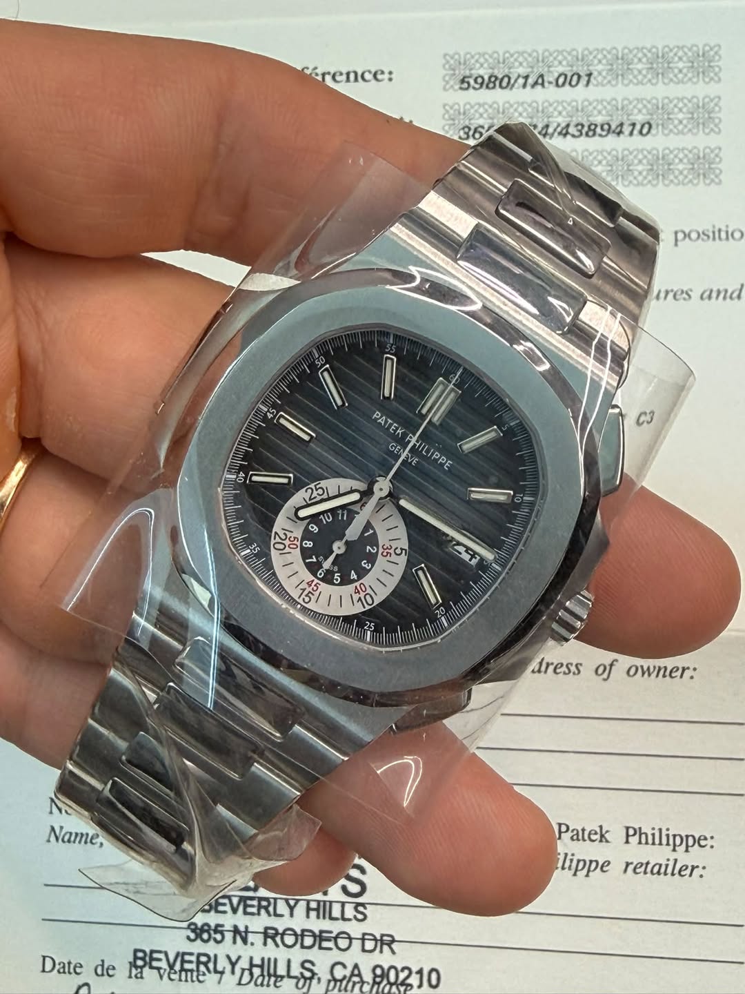 May be an image of wrist watch and text