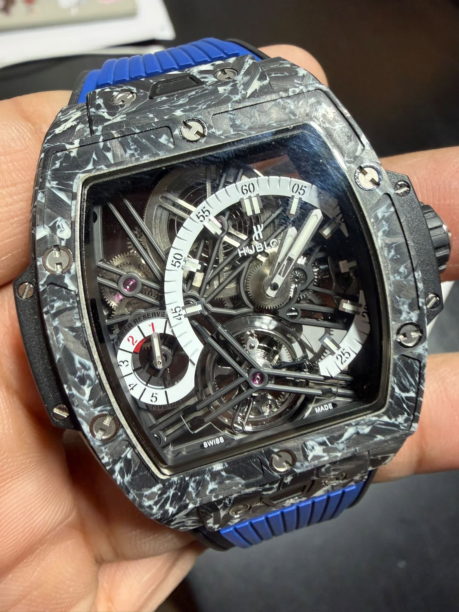 May be an image of wrist watch and text