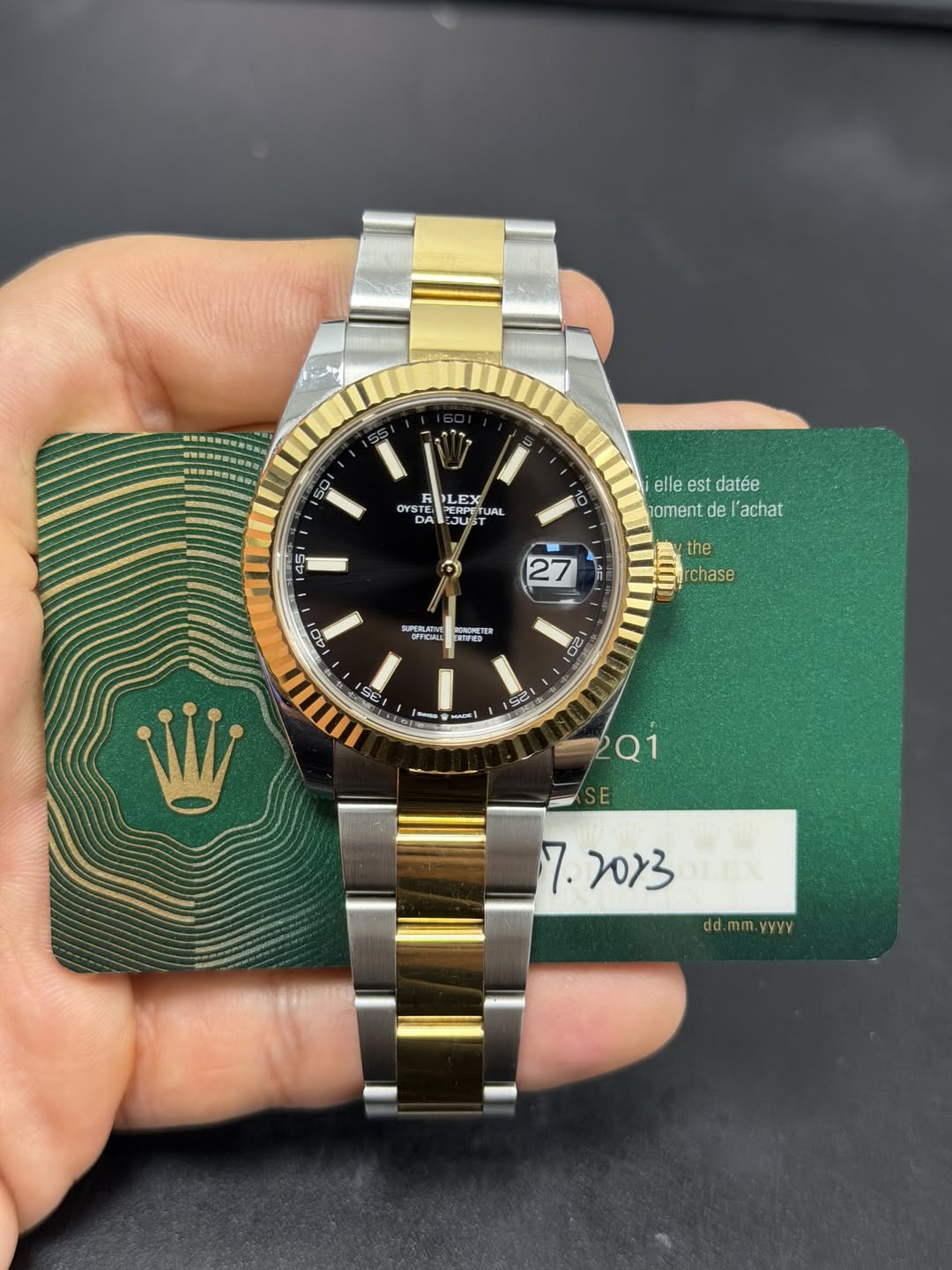 May be an image of wrist watch and text that says '国者館所 50 PLEX oY OYS DYSTE መ PERPETU UAL DA sUS 10 45 45 elle.e est datée oment de achat 27 مفد the rchase 401 RSTICAS EATNED…