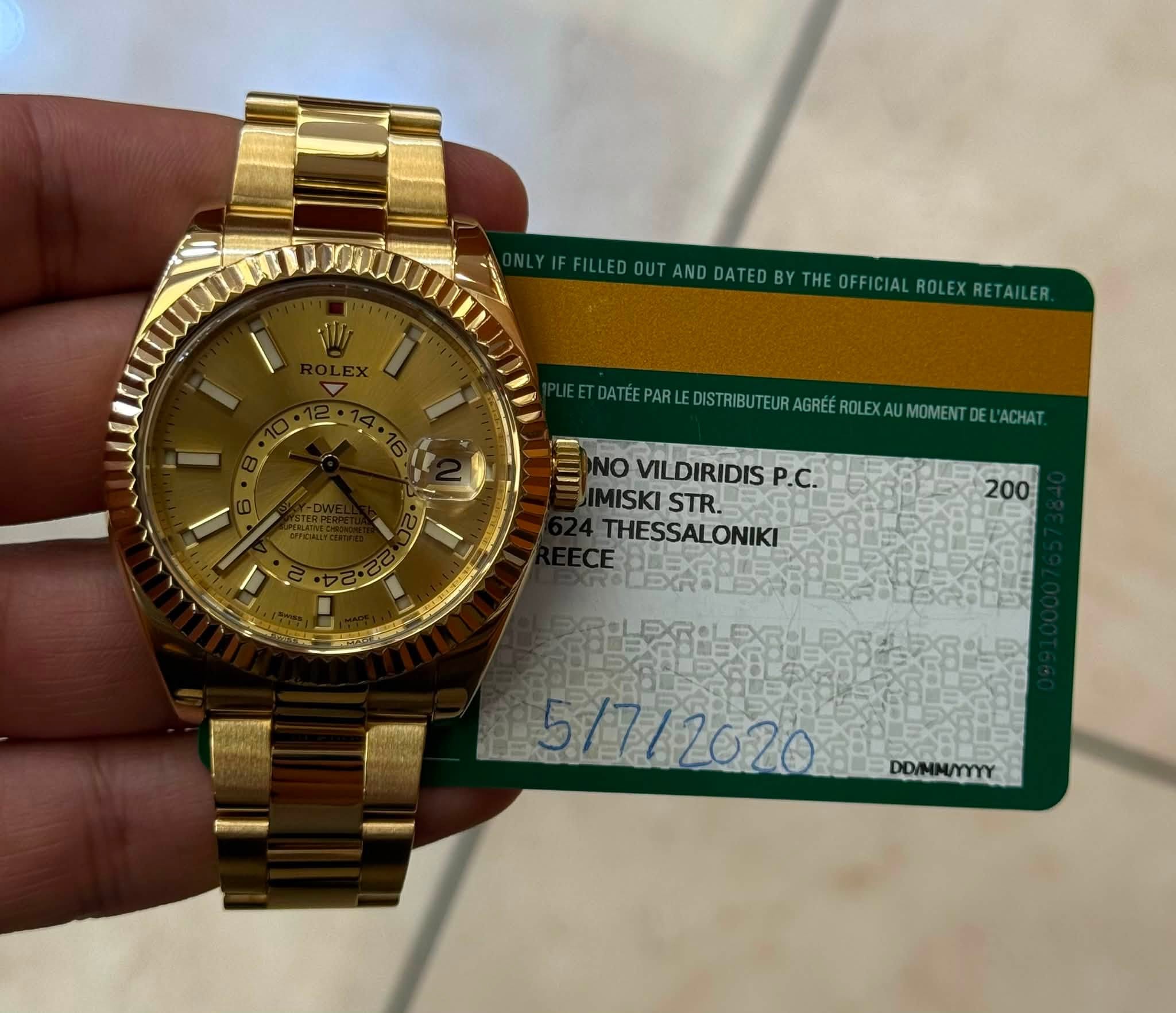May be an image of wrist watch, money and text