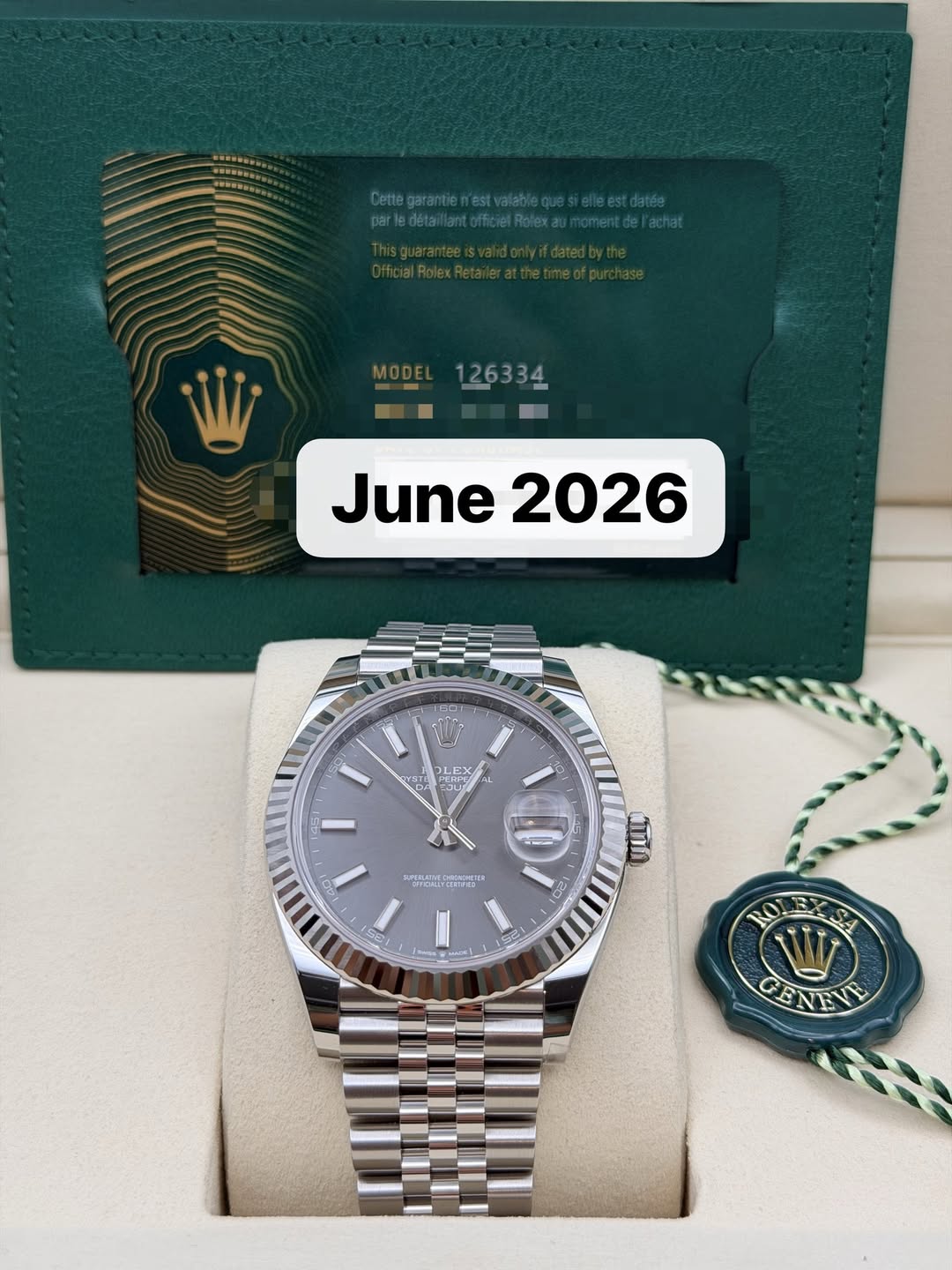 May be an image of wrist watch and text that says 'MODE 126334 June June2026 2026 د JLEX γ YHT OLE rEPA PERPO KTE GLI ร మು 20 20 SA GENEVE GEN'