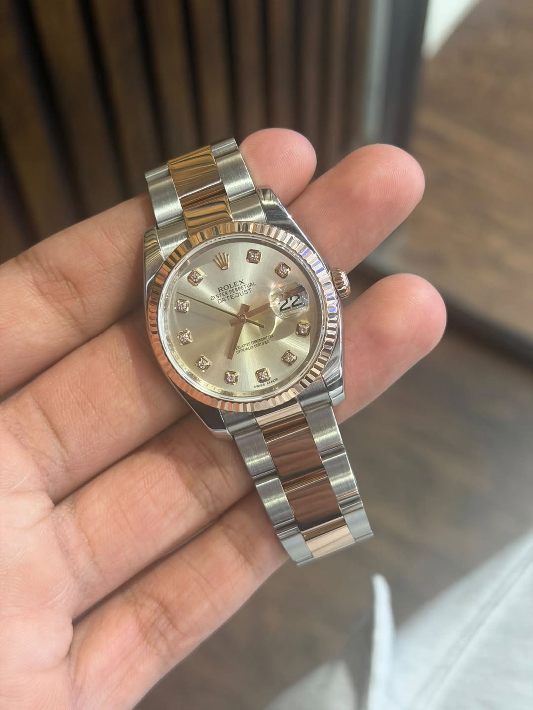 May be an image of wrist watch and text