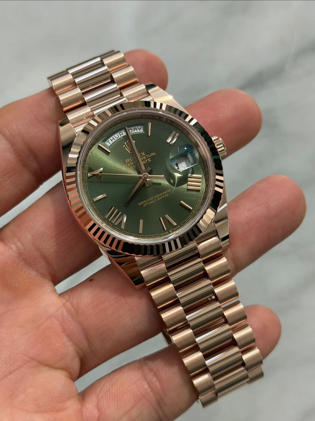 May be an image of wrist watch and text