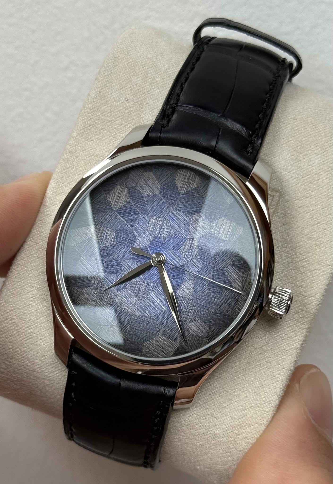 May be an image of wrist watch and text