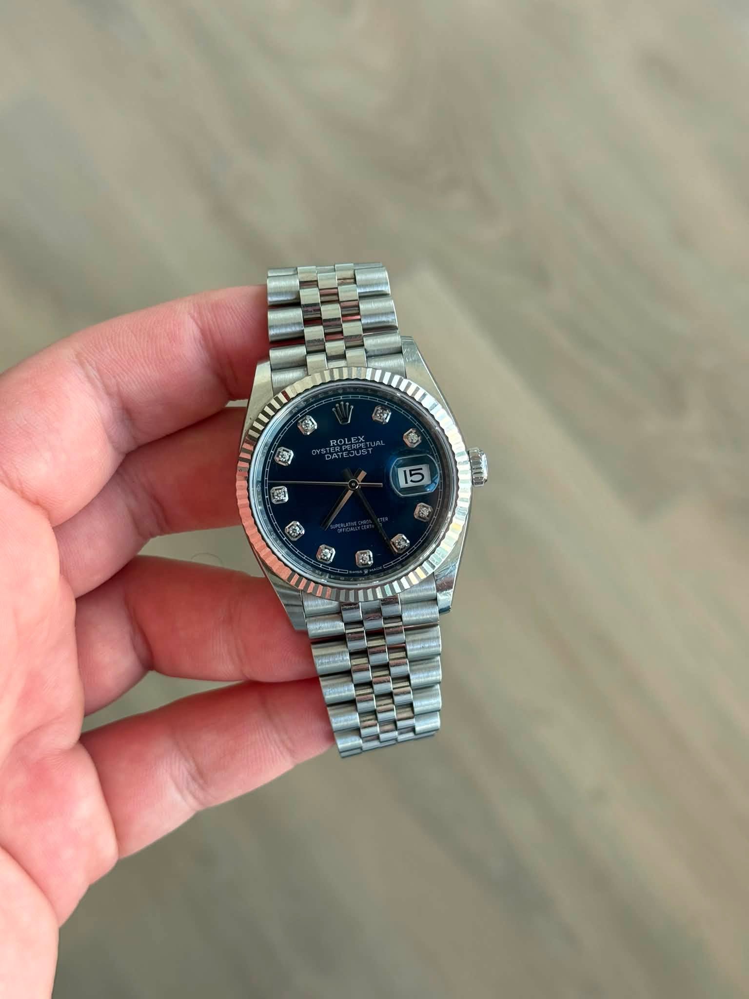 May be an image of wrist watch and text